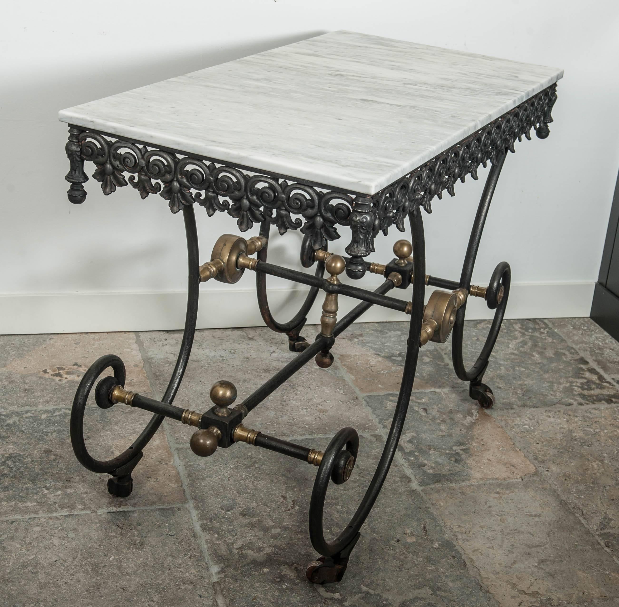 Antique French cast iron, wrought iron and brass butcher table, circa 1900. With Carrara marble top.