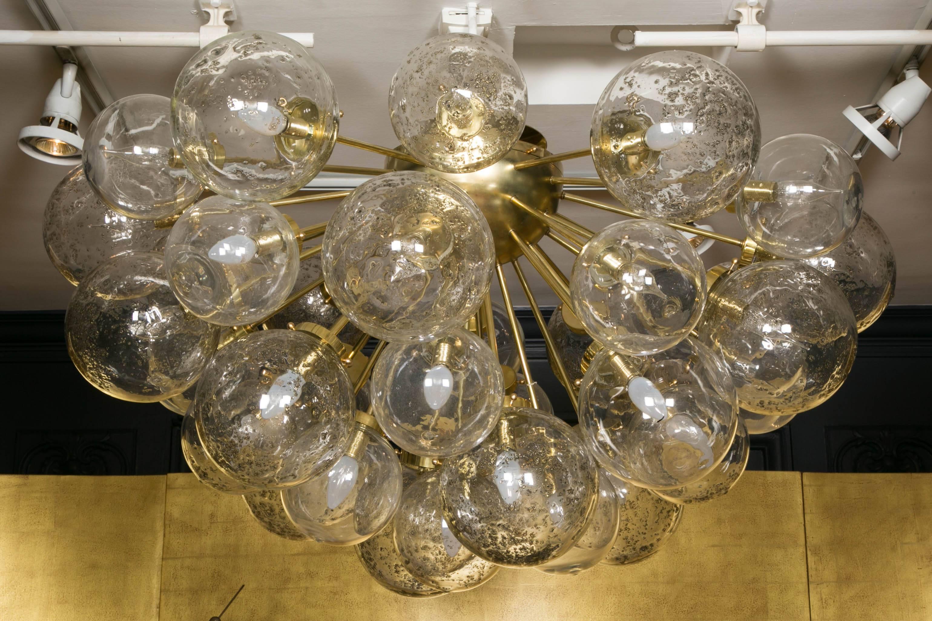 Vintage chandelier in brass and Murano blown glass balls (around 30 lights). The balls are old, the brass structure is new.