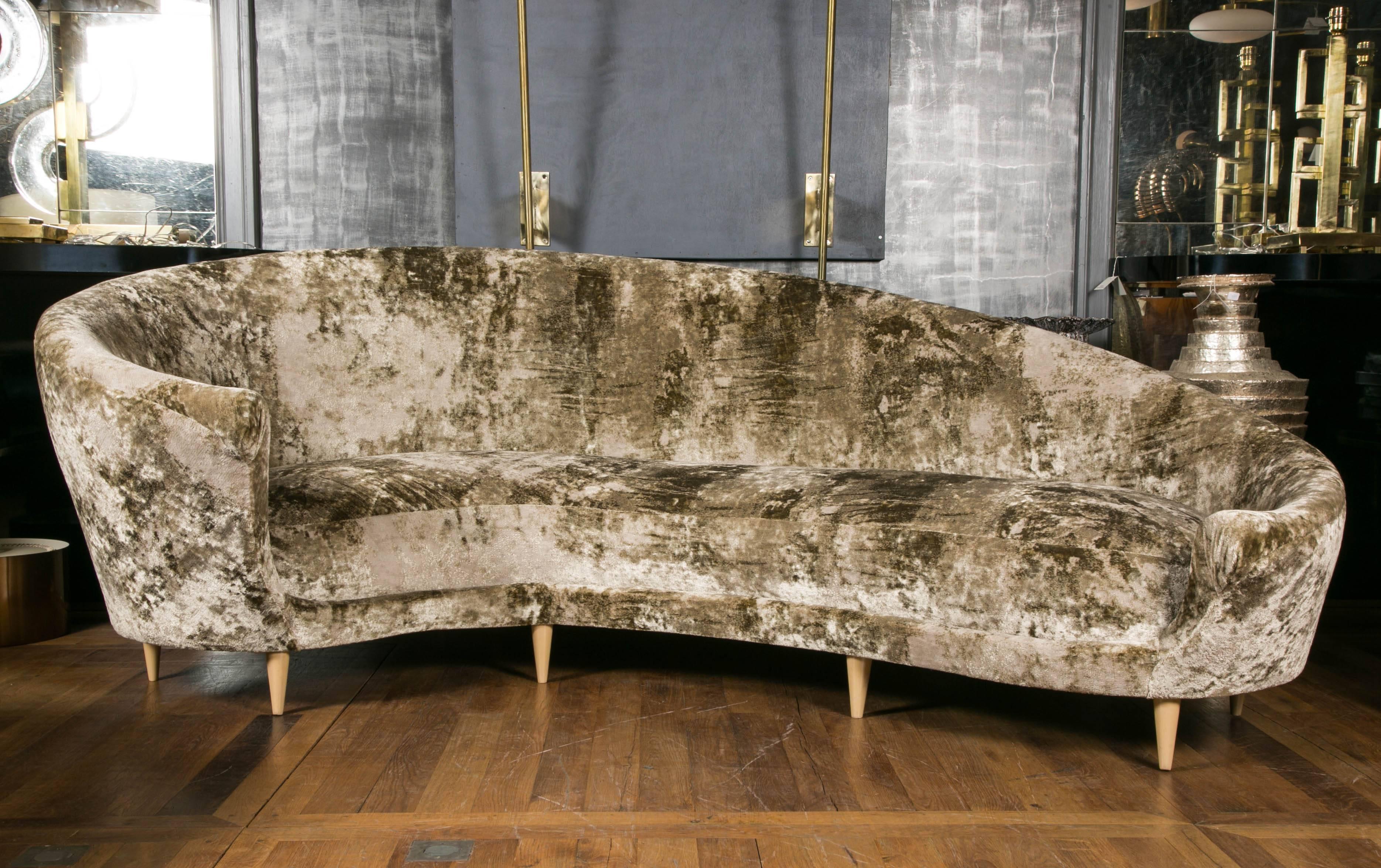 Vintage sofa with cushions, upholstered with Nobilis fabric, eight wood feet.