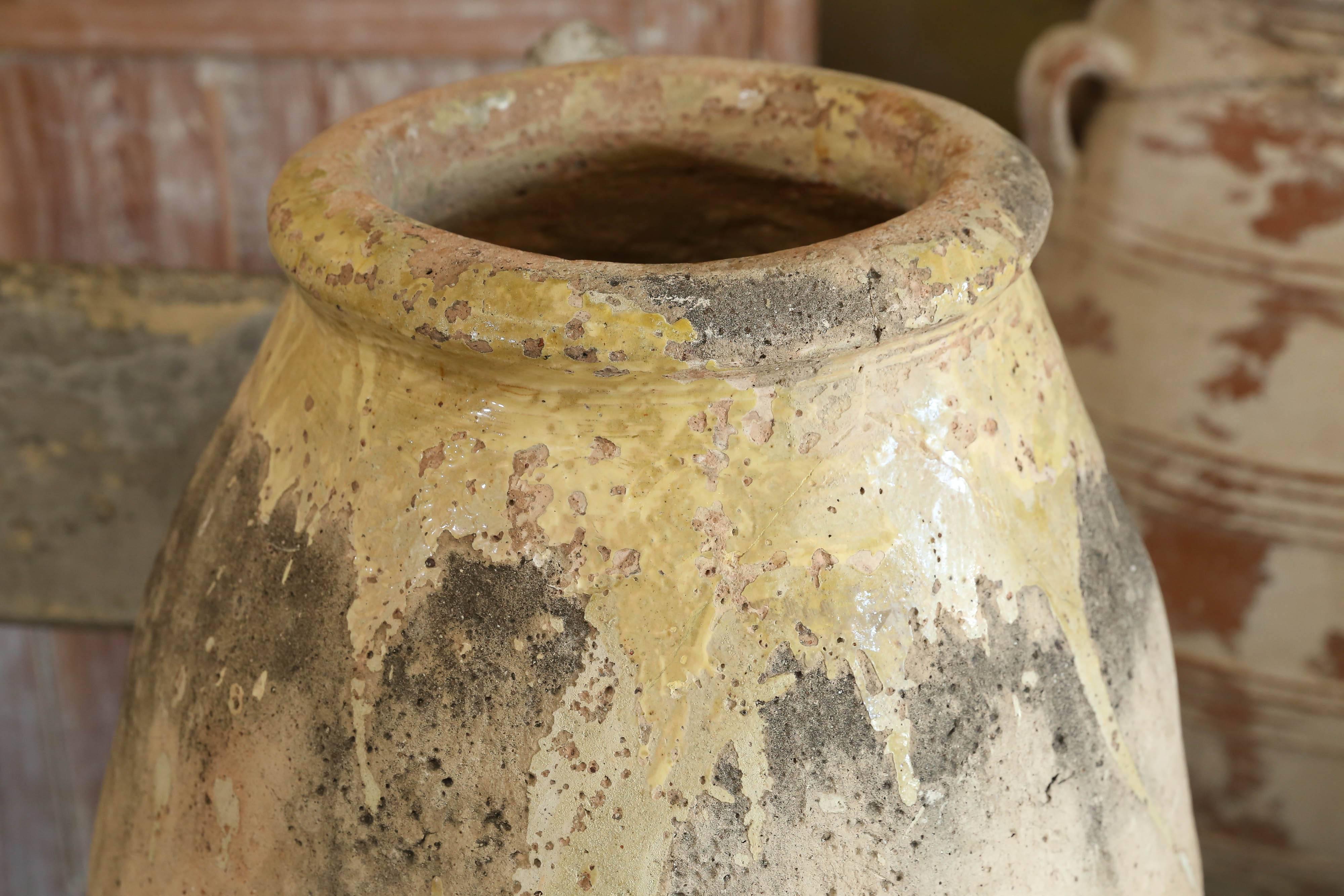 Early 19th century terra cotta biot jar with glazed top rim.