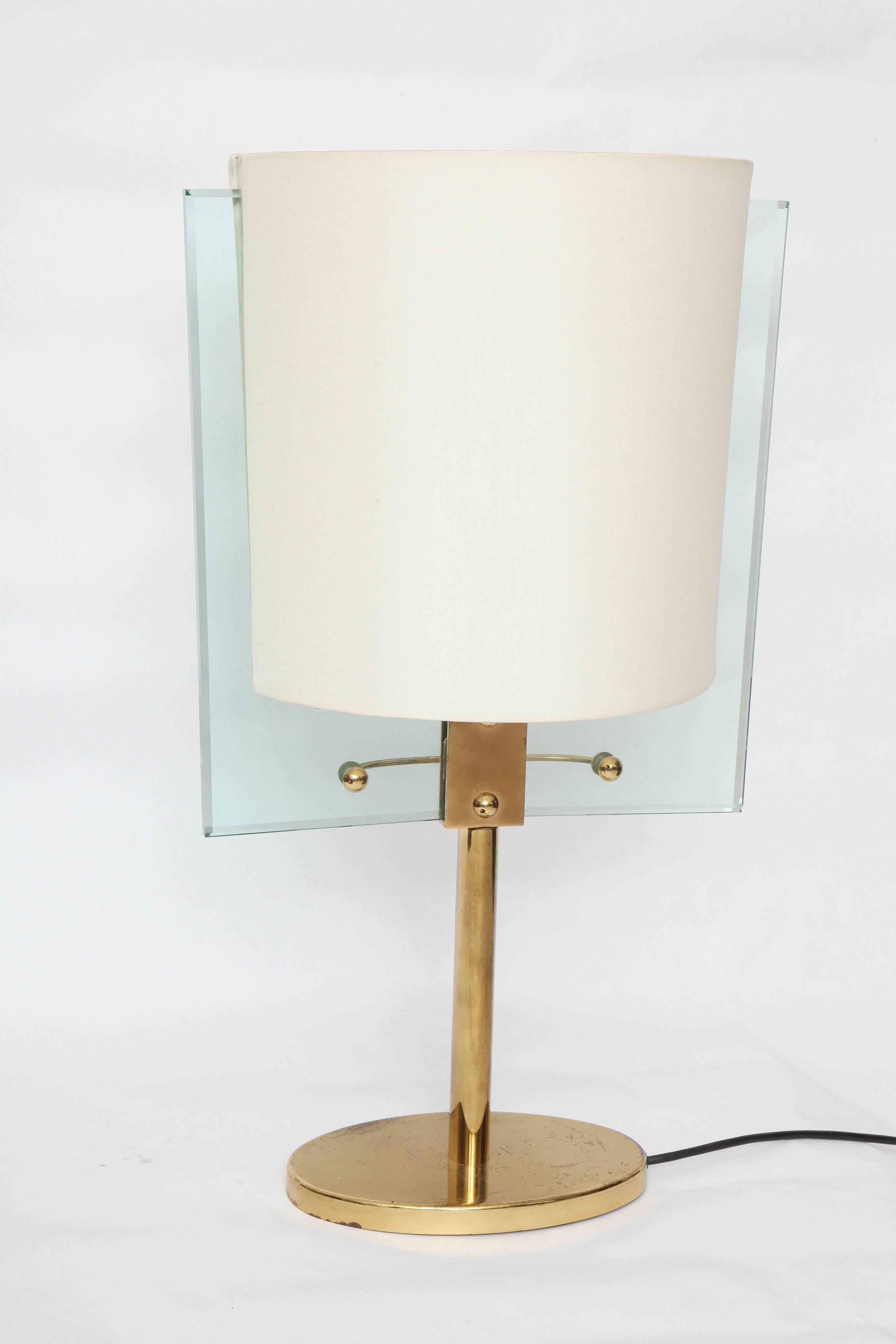 A Italian glass and brass table lamp by Fontana Arte designed by Nathalie Grenon.
  