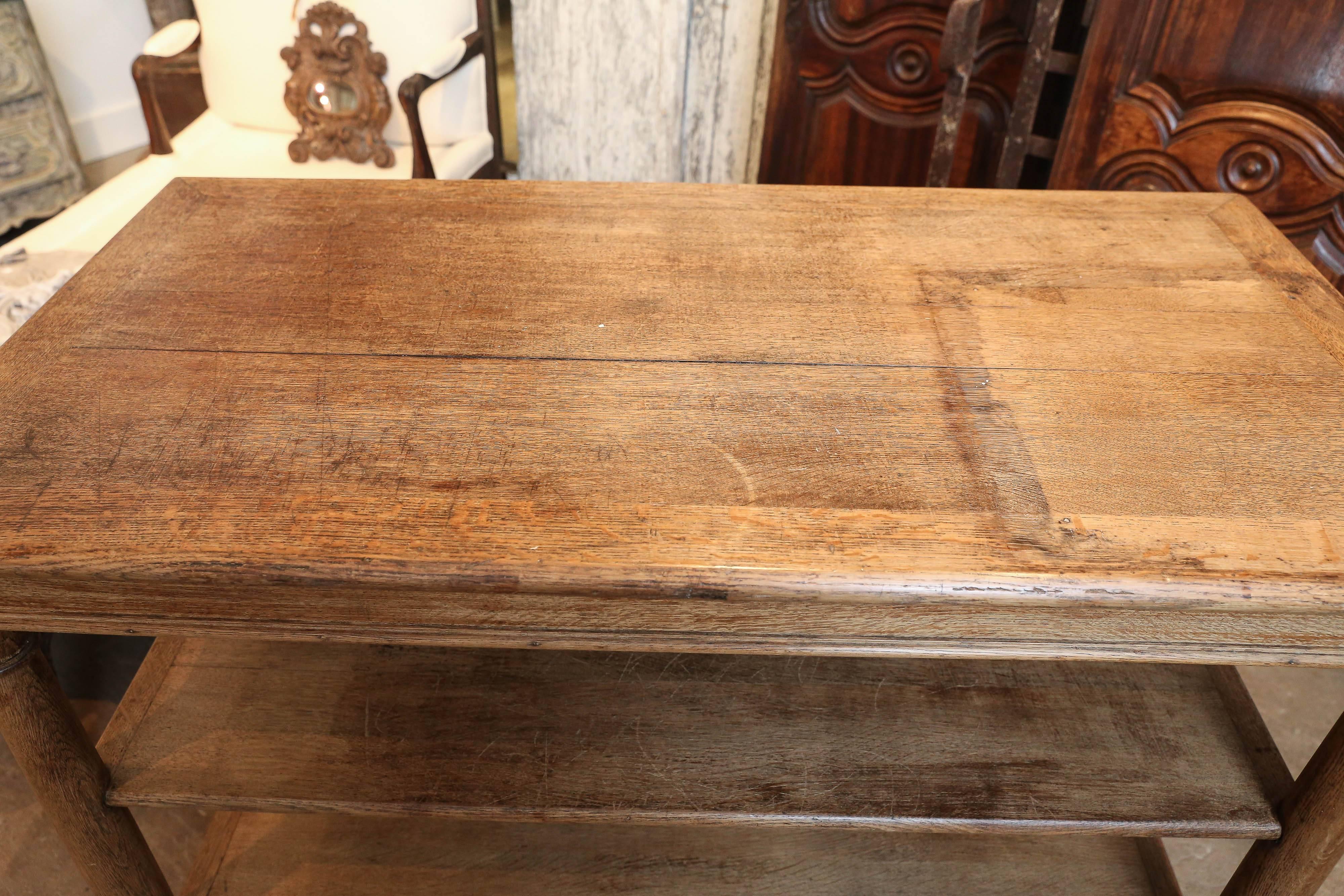 19th century three-tiered shop table from Belgium. Would be a wonderful kitchen island or a storage piece in a playroom.