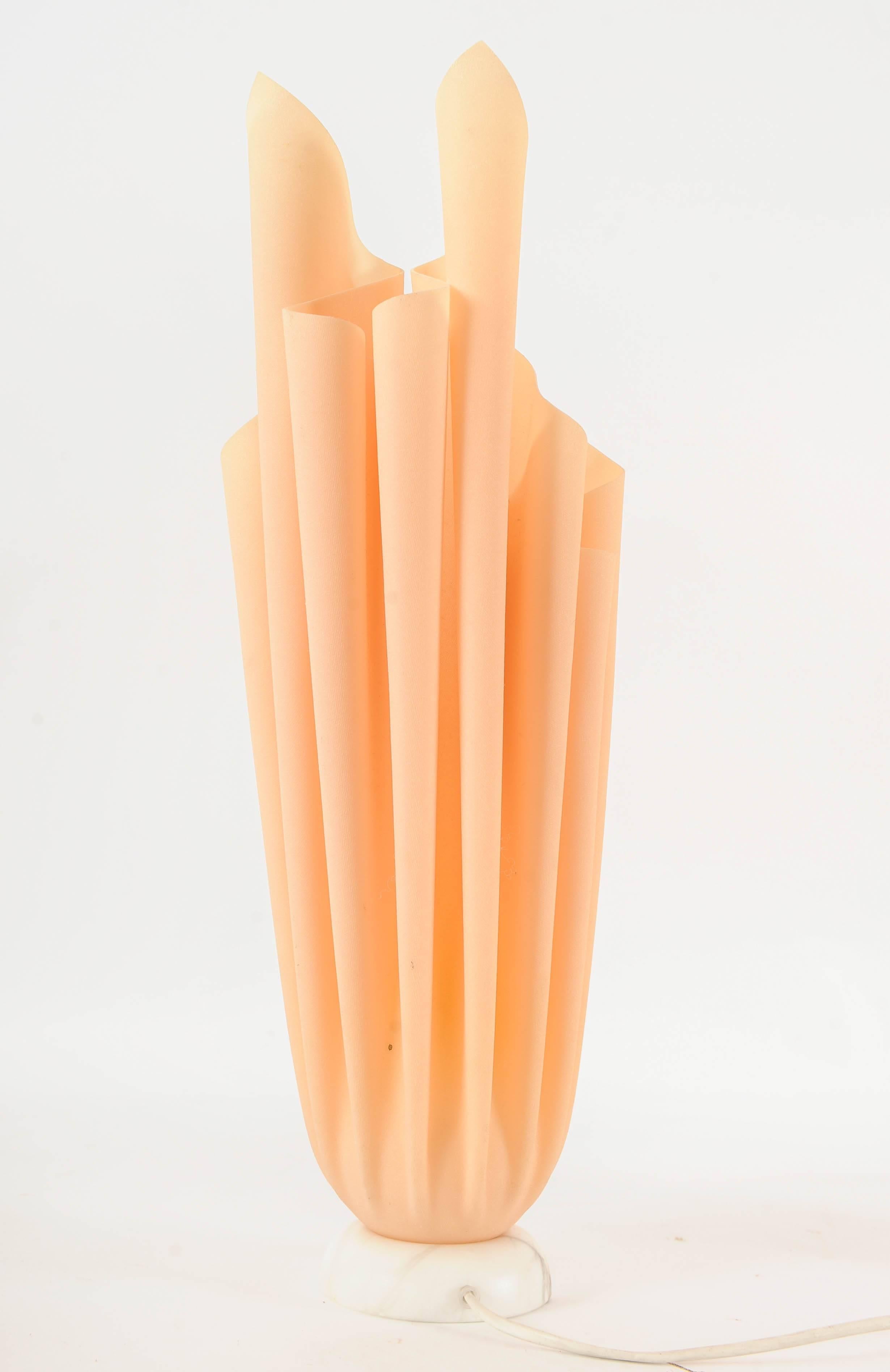 A pair of Athena lamps designed by Georgia Jacob. She imagined a hand kerchief in its hanging down shape, but then standing up. This was realised by giving the cloth a raisin bath. The bases are made of marble.

Smaller lamp: 51.5 cm high (18 cm