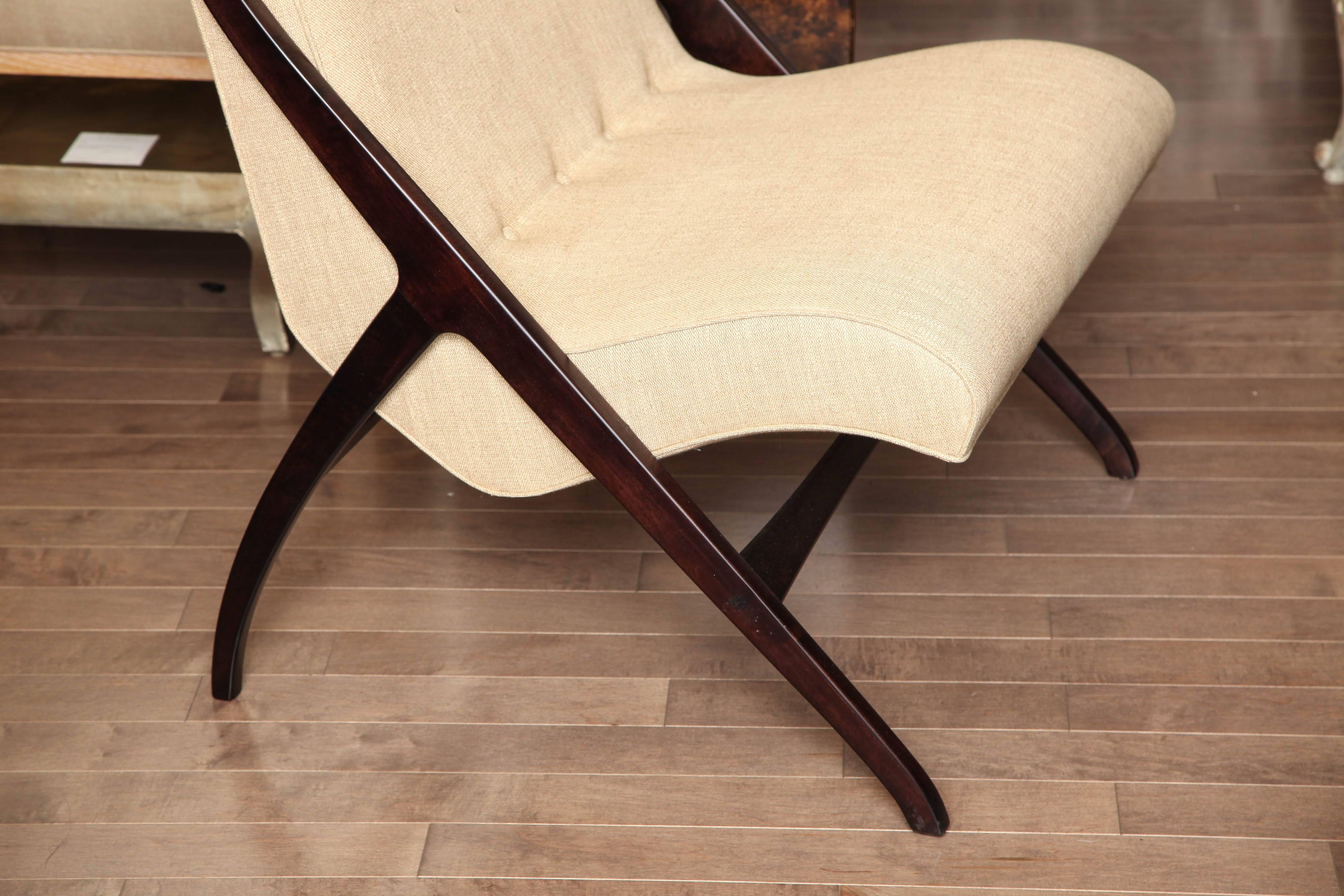 Pair of graceful Scandinavian sling-style lounge chairs with darkwood frame, upholstered in textured woven taupe fabric, circa 1960.