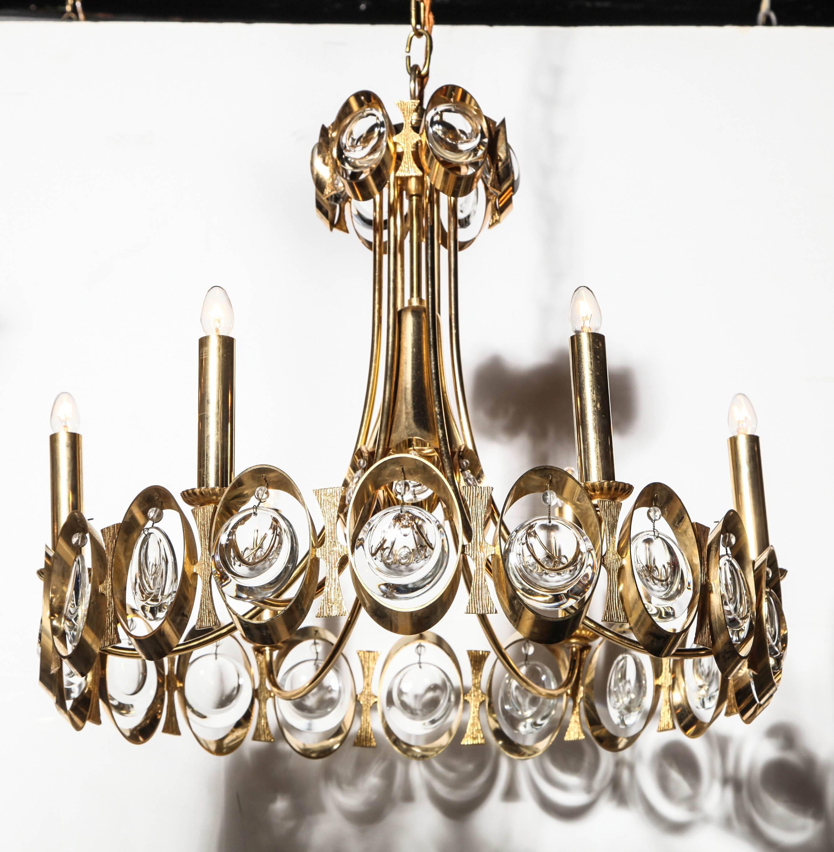 Palwa Germany Gilt Brass and Austrian Clear Crystal Hanging Pendant, 1960s. Featuring a round gilt Brass ring with six candlesticks and three levels of hanging shimmering transparent Austrian crystals. Adjustable height. Brilliant. Reflective.