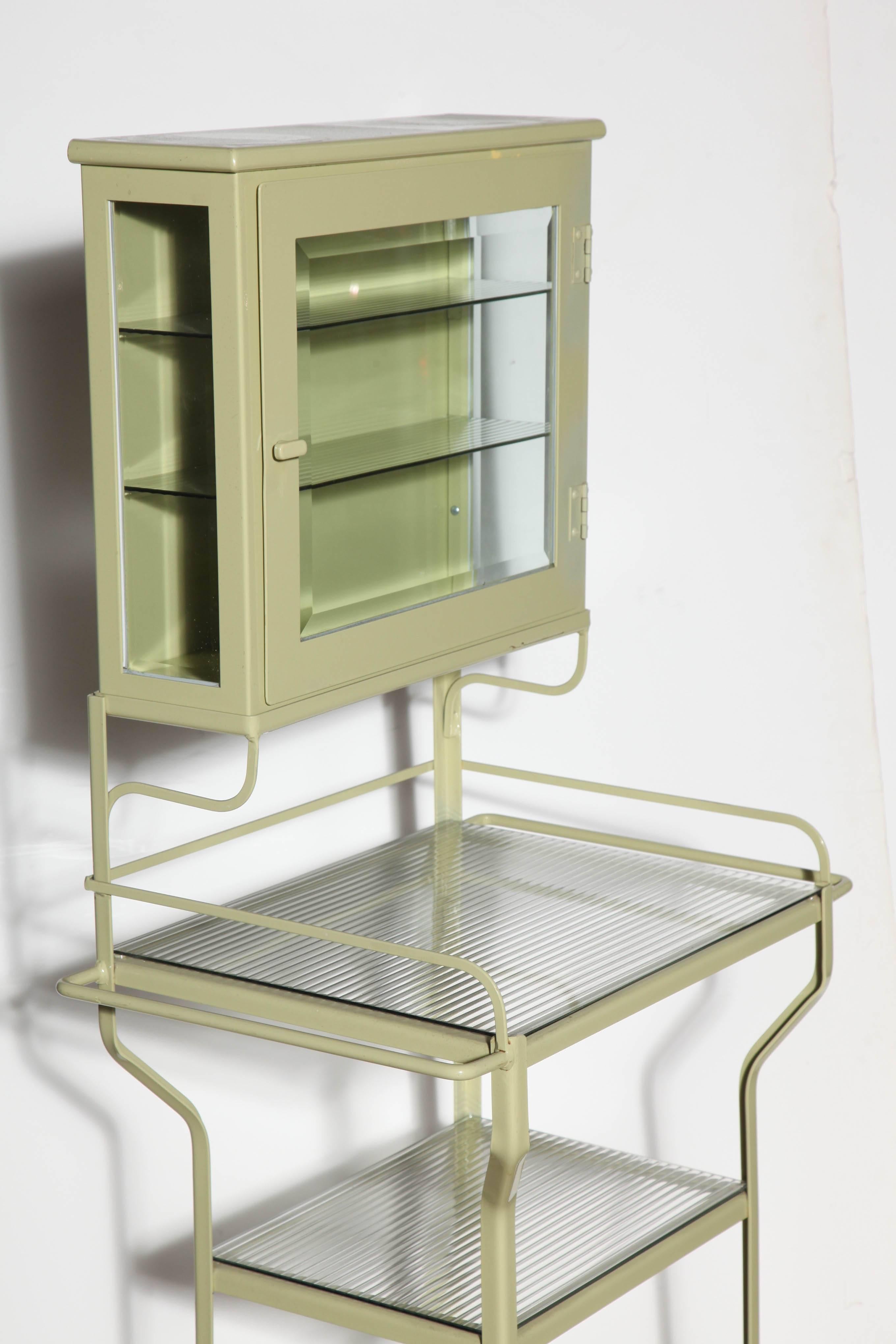 Pale Green Enamel & Glass Storage Cabinet with Five Optical Glass Shelves, 1920s In Good Condition In Bainbridge, NY