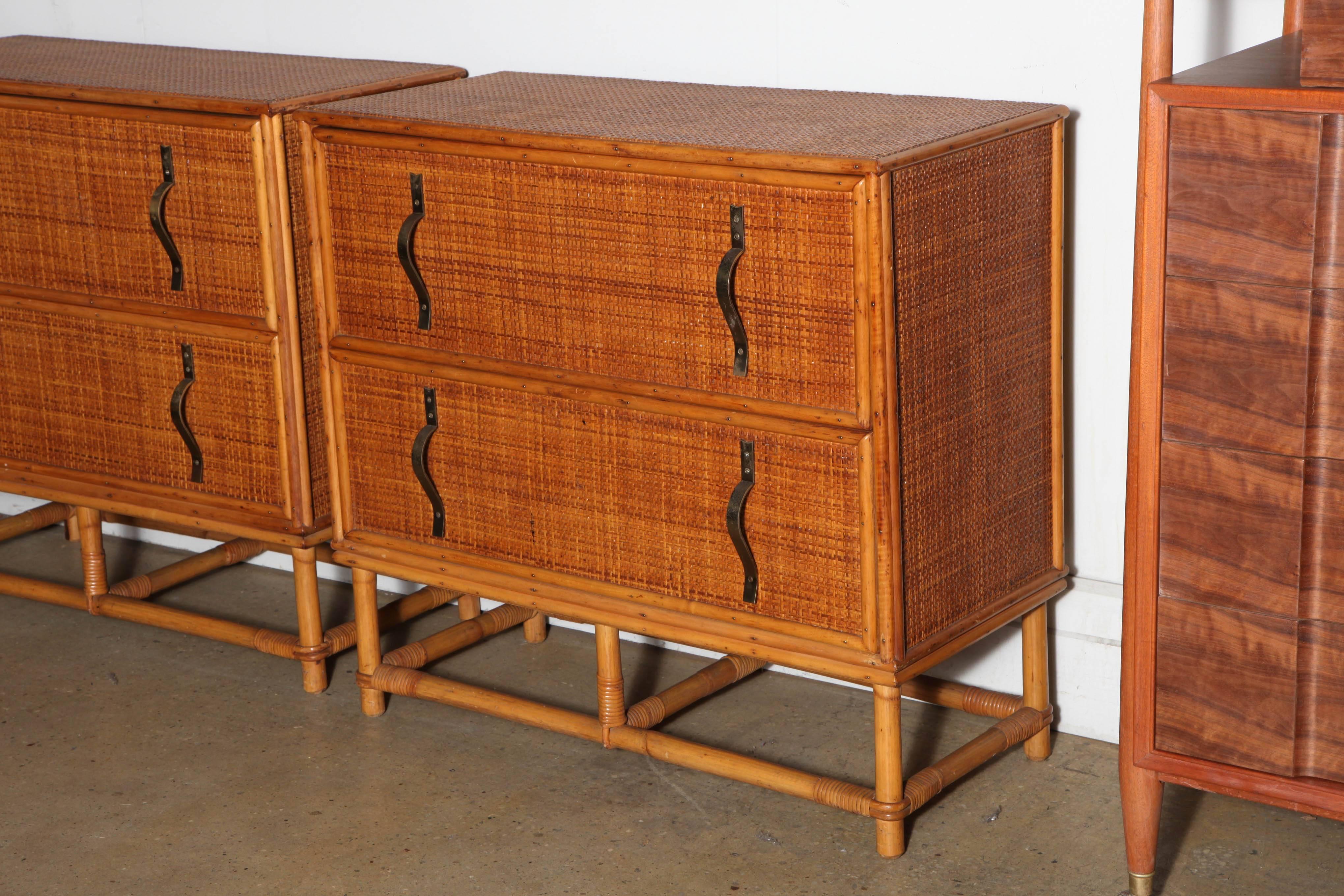 2 elegant late 1930's California Modern Paul T. Frankl rectangular Bamboo and Rattan Dressers or large Nightstands. with 2 deep drawers, an open rectangular Bamboo framework base and vertical Brass Banner Ribbon pulls 