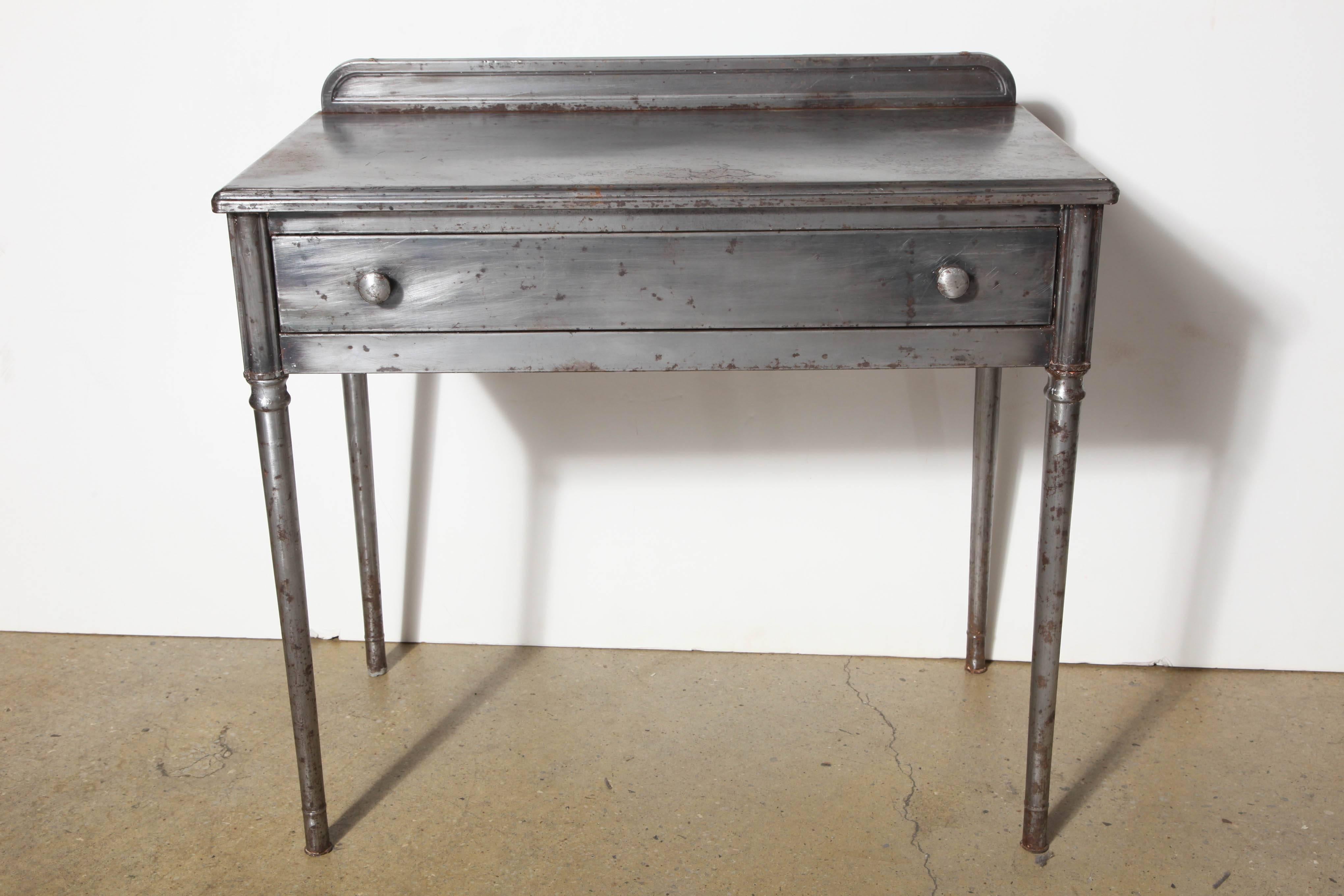 early 20th century Edwardian Industrial Steel Vanity or Edwardian Desk.  
With large drawer. Old vintage distressed metal.  Paint removed, sealed