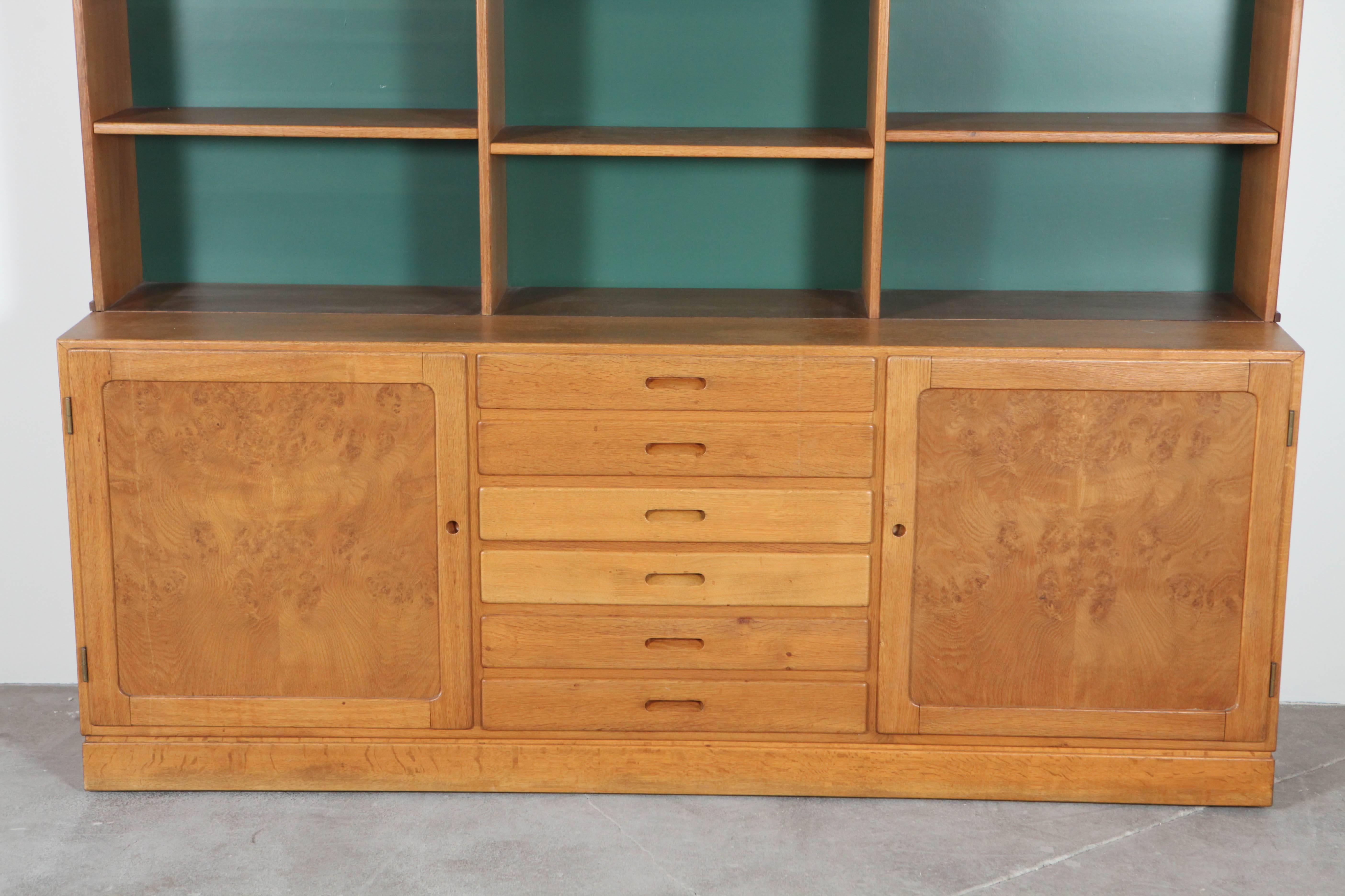 Mid-Century Danish burlwood cabinet and bookshelf. Green backing. One cabinet has hole drilled out for electrical outlets. Top of lower cabinet measures 28.5