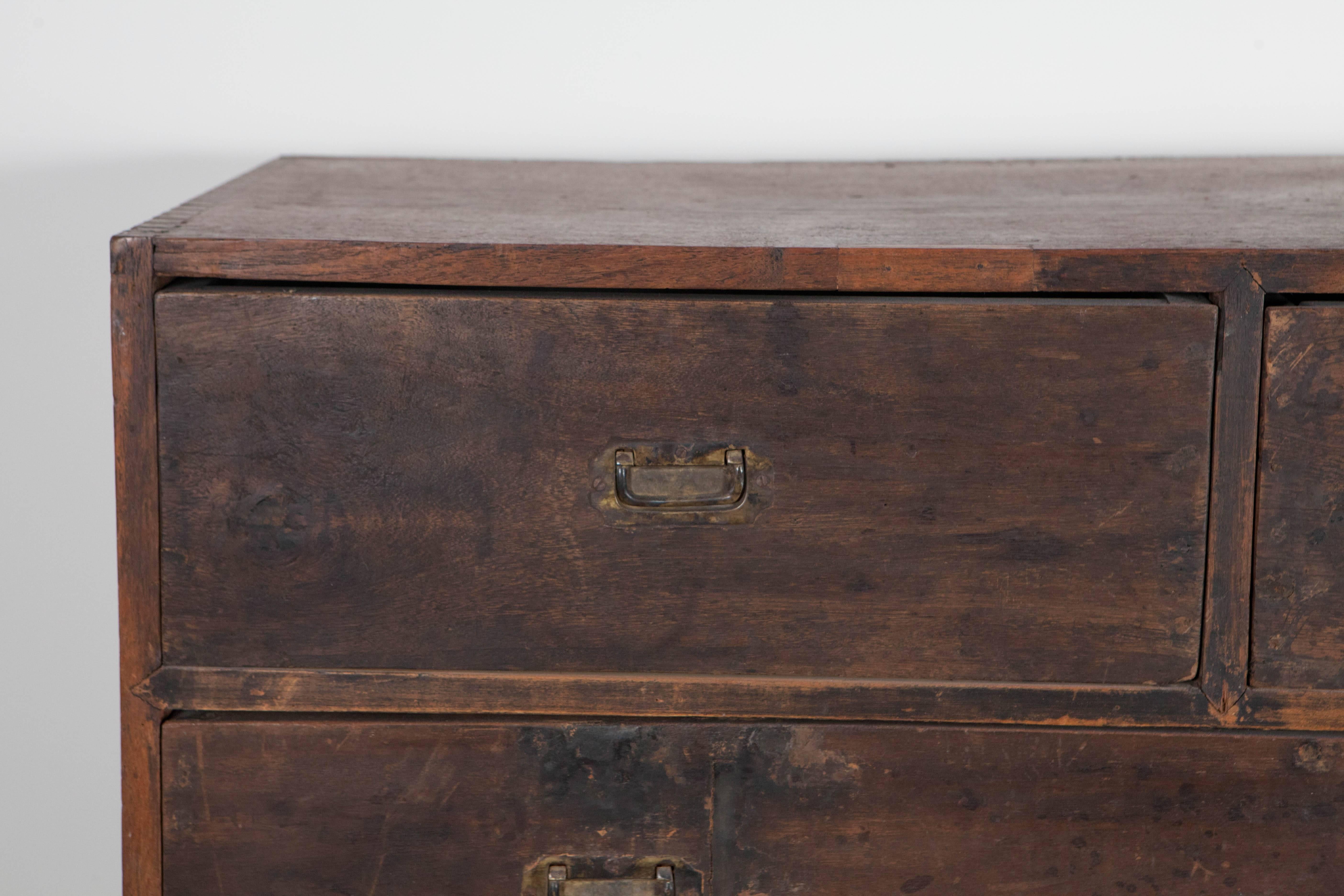 Well worn Tansu in dark wood and revealing dove tail joinery. Possibly Japanese, but unknown origin.