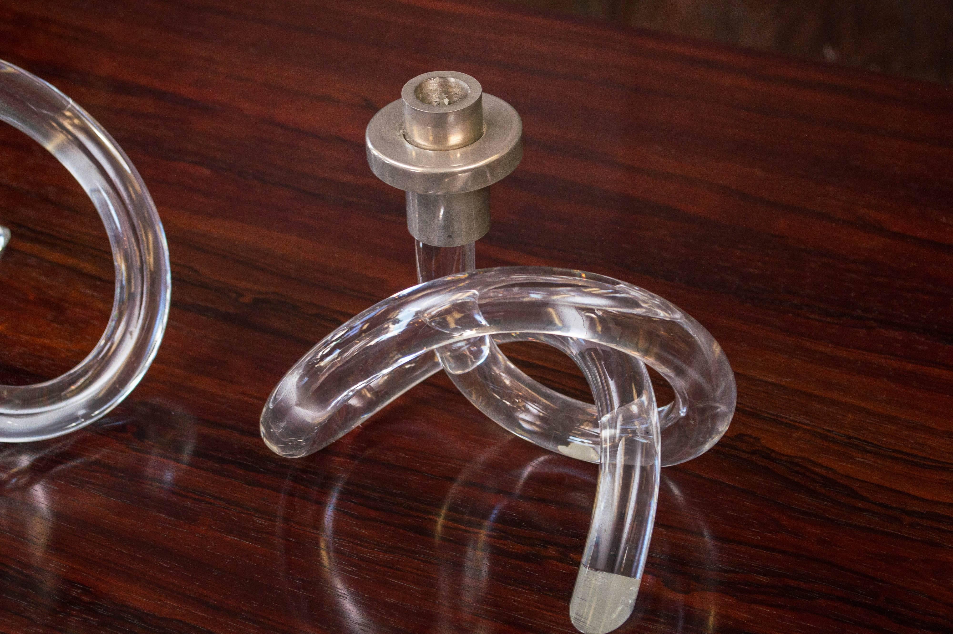 A wonderful set of three Dorothy Thorpe Lucite candleholders, large Lucite rods tied up like a pretzel, with one end caped with the candle holder