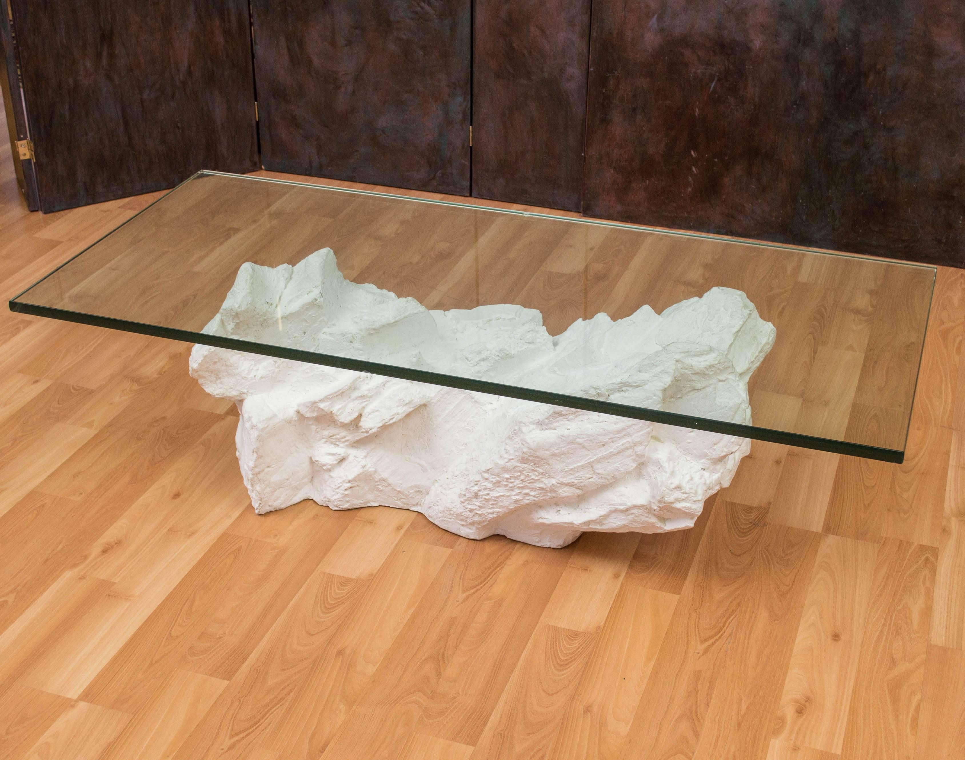 A fantastic White plaster coffee table by Sirmos, wonderful detailing with it's rocks in layers look. Base it's self is about 37 x 17 x 15.50, glass is 3/4.