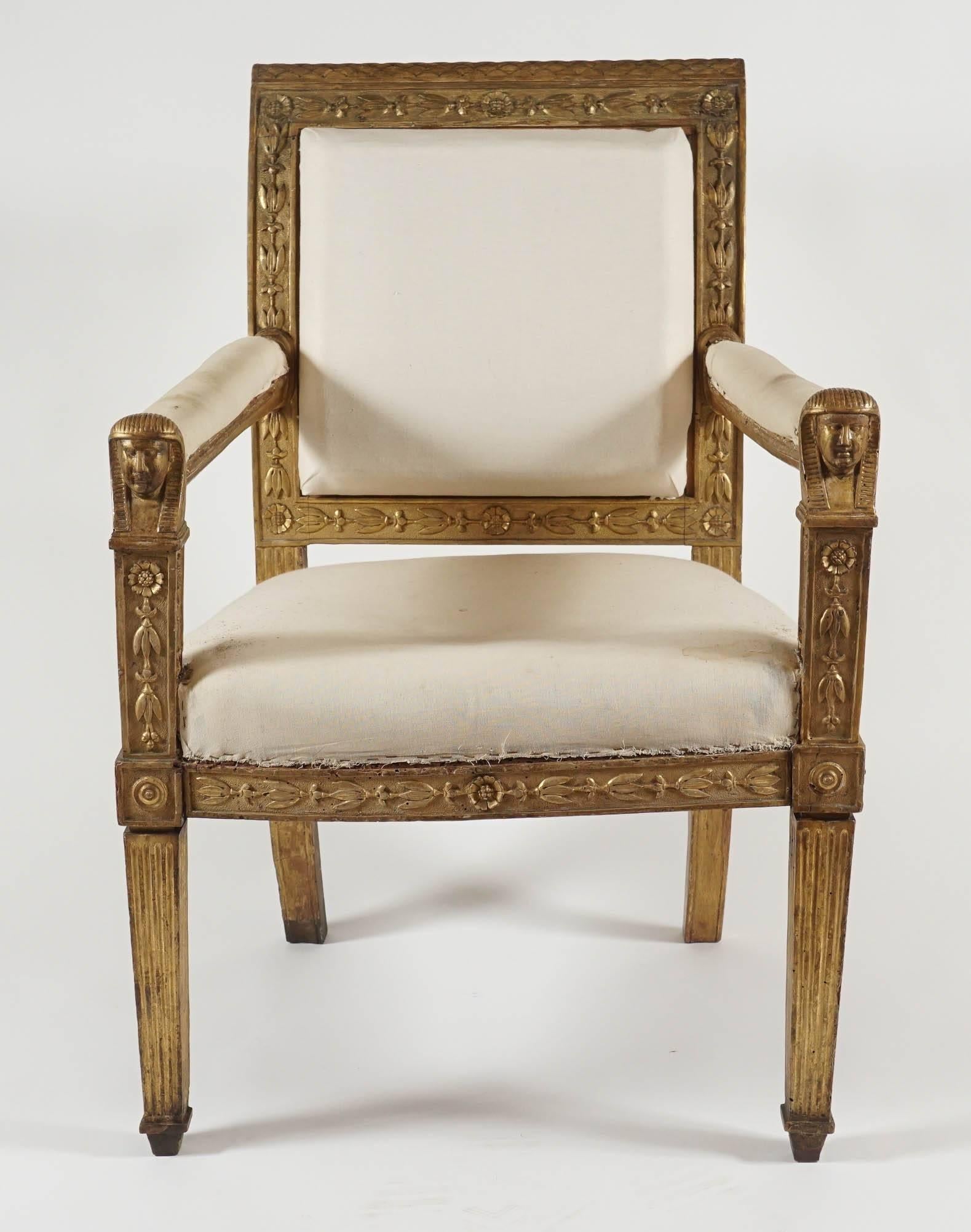 An important Italian giltwood fauteuil of exceptional design and exquisite detail crafted in Naples and attributed to Pietro Galizia, circa 1810, having fish-scale crest-rail and upholstered back with carved honey-suckle and flower border joining