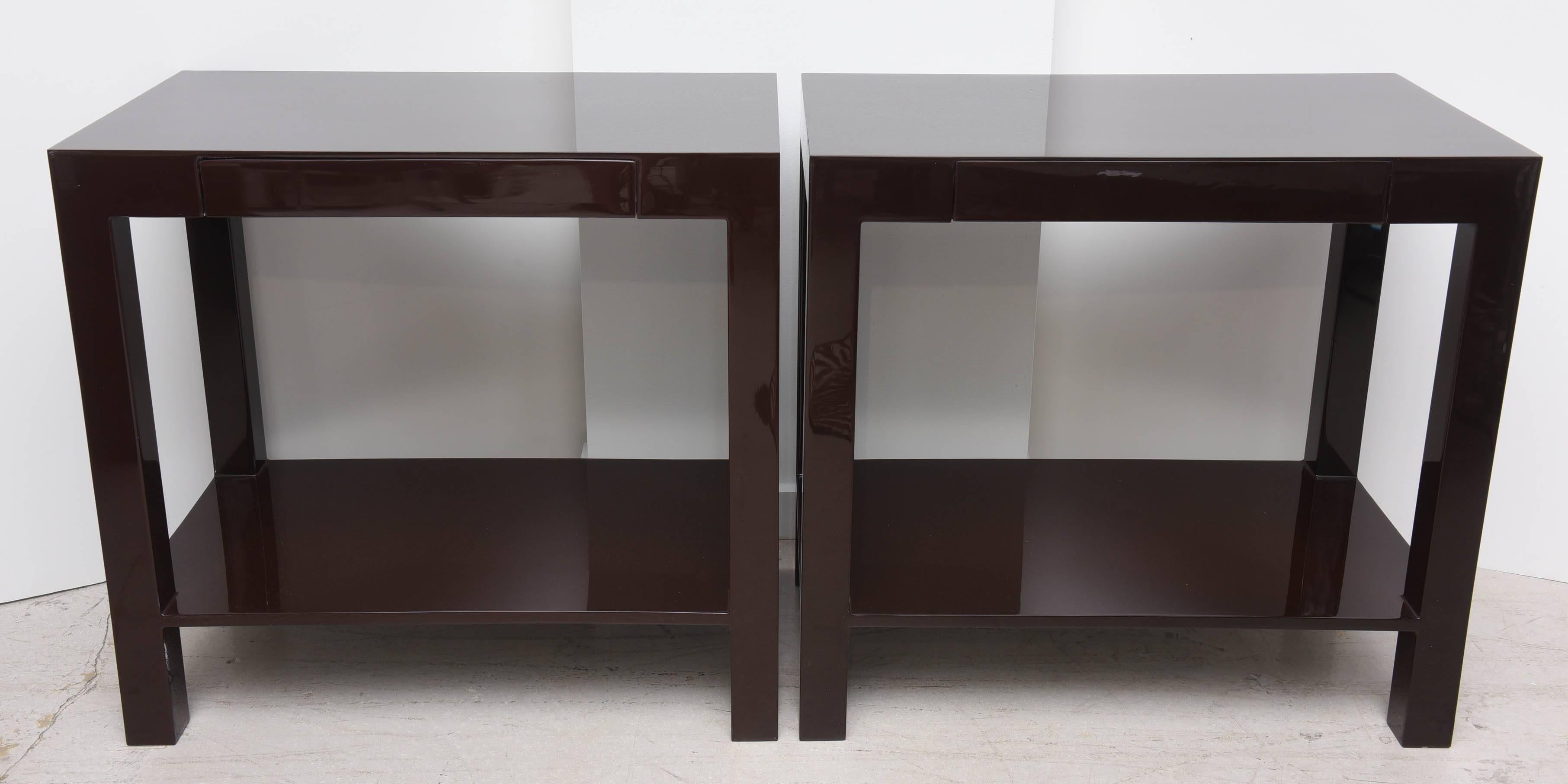 Pair of chocolate brown lacquer two-tier tables.