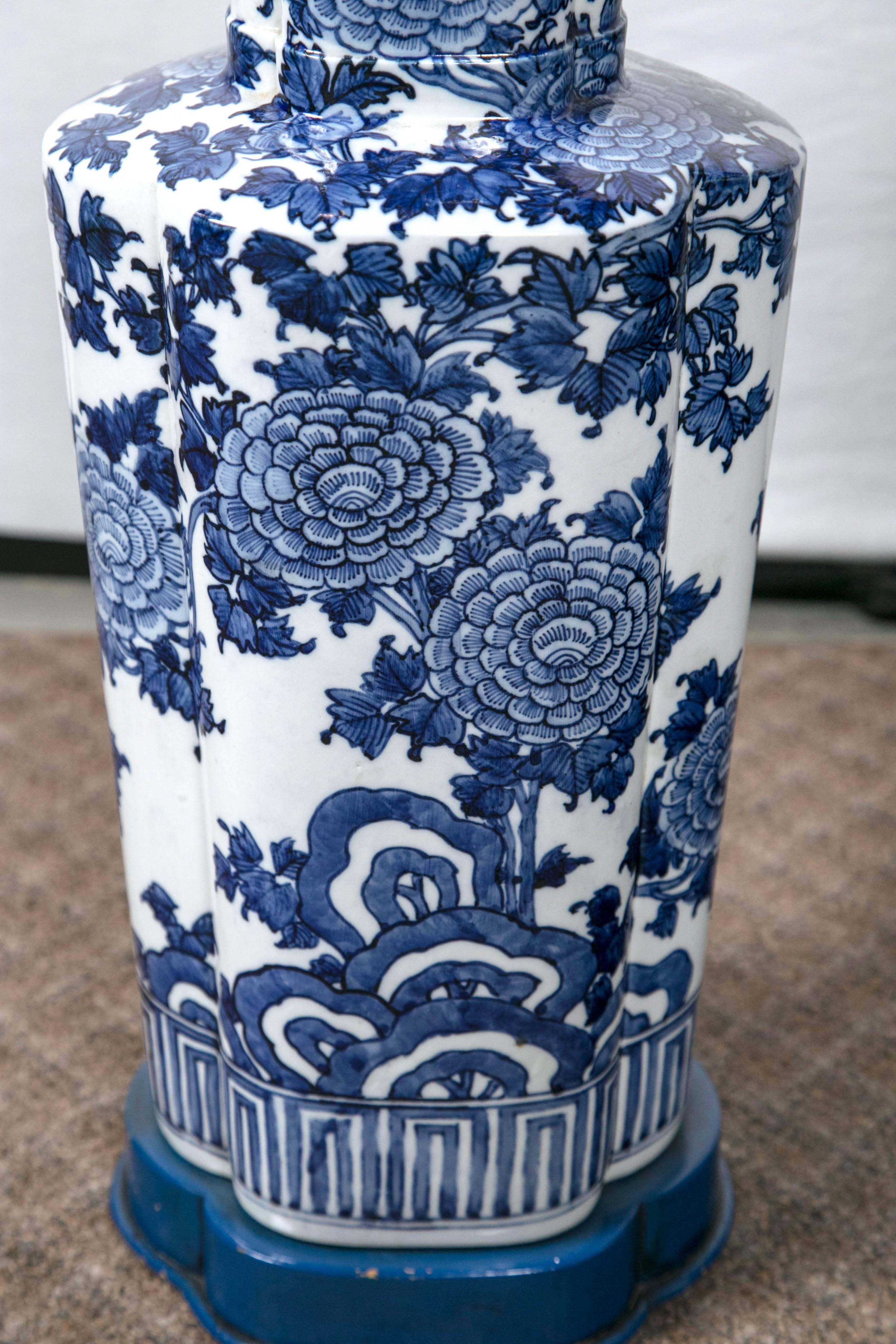 A lovely pair of blue and white porcelain Asian style lamps. Great finials.