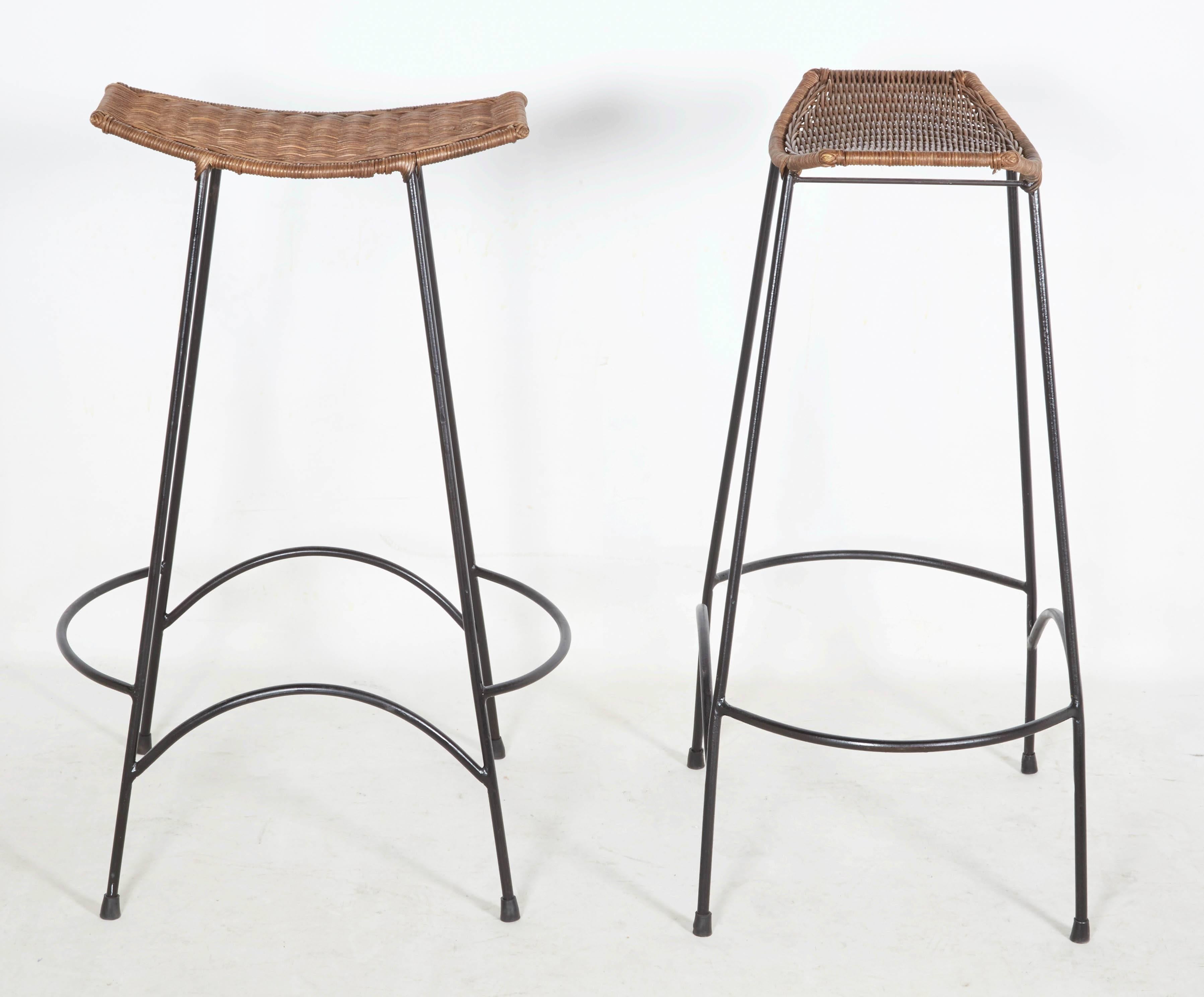 Charming pair of wrought iron stools with woven rattan seats. The stools are stackable. Please contact for location. 