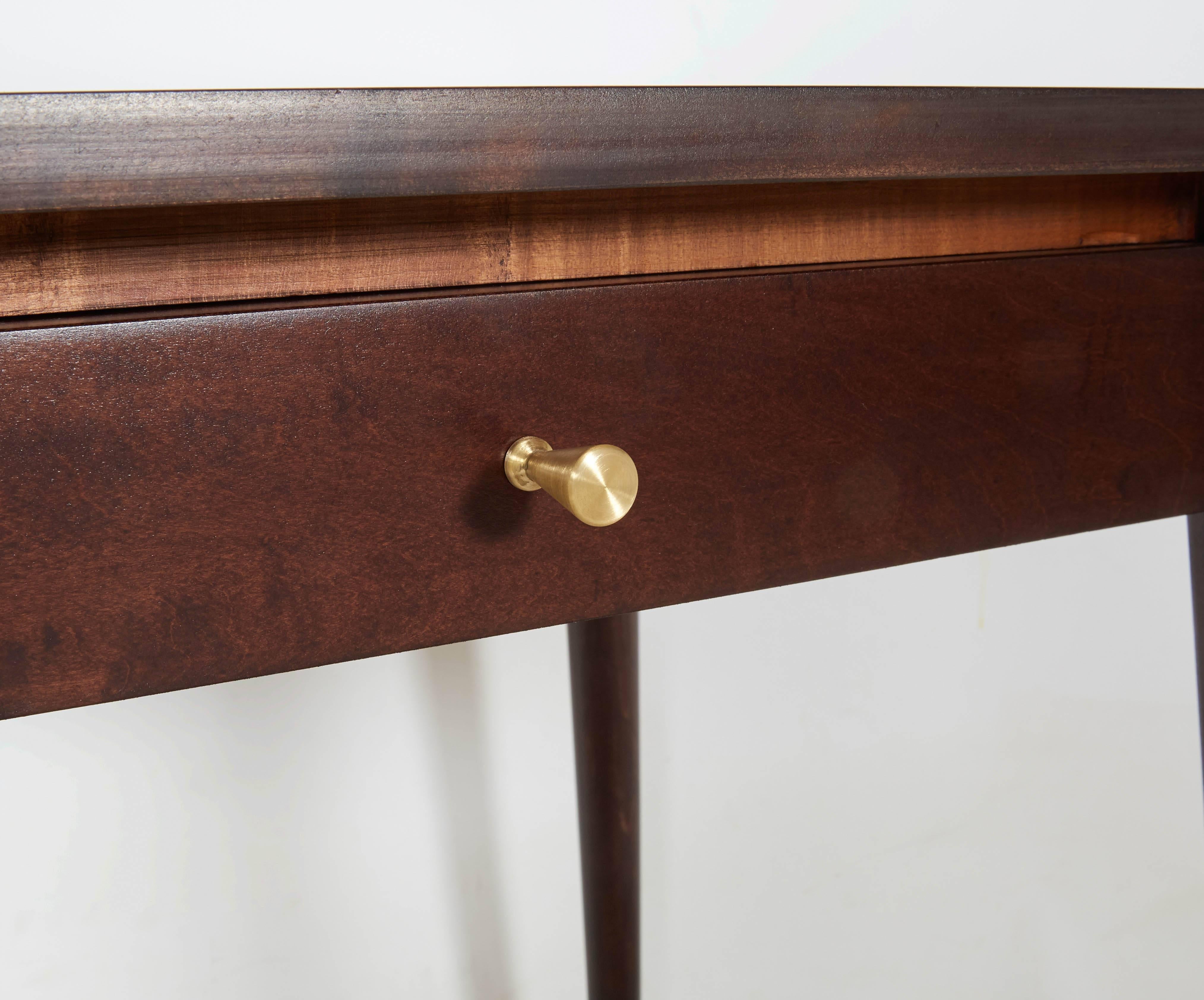 Classic Paul McCobb Planner Group nightstands or end tables beautifully restored in a rich dark stain and accented with McCobb's signature brass pulls. Please contact for location. Offered by Las Venus by Kenneth Clark, New York City.