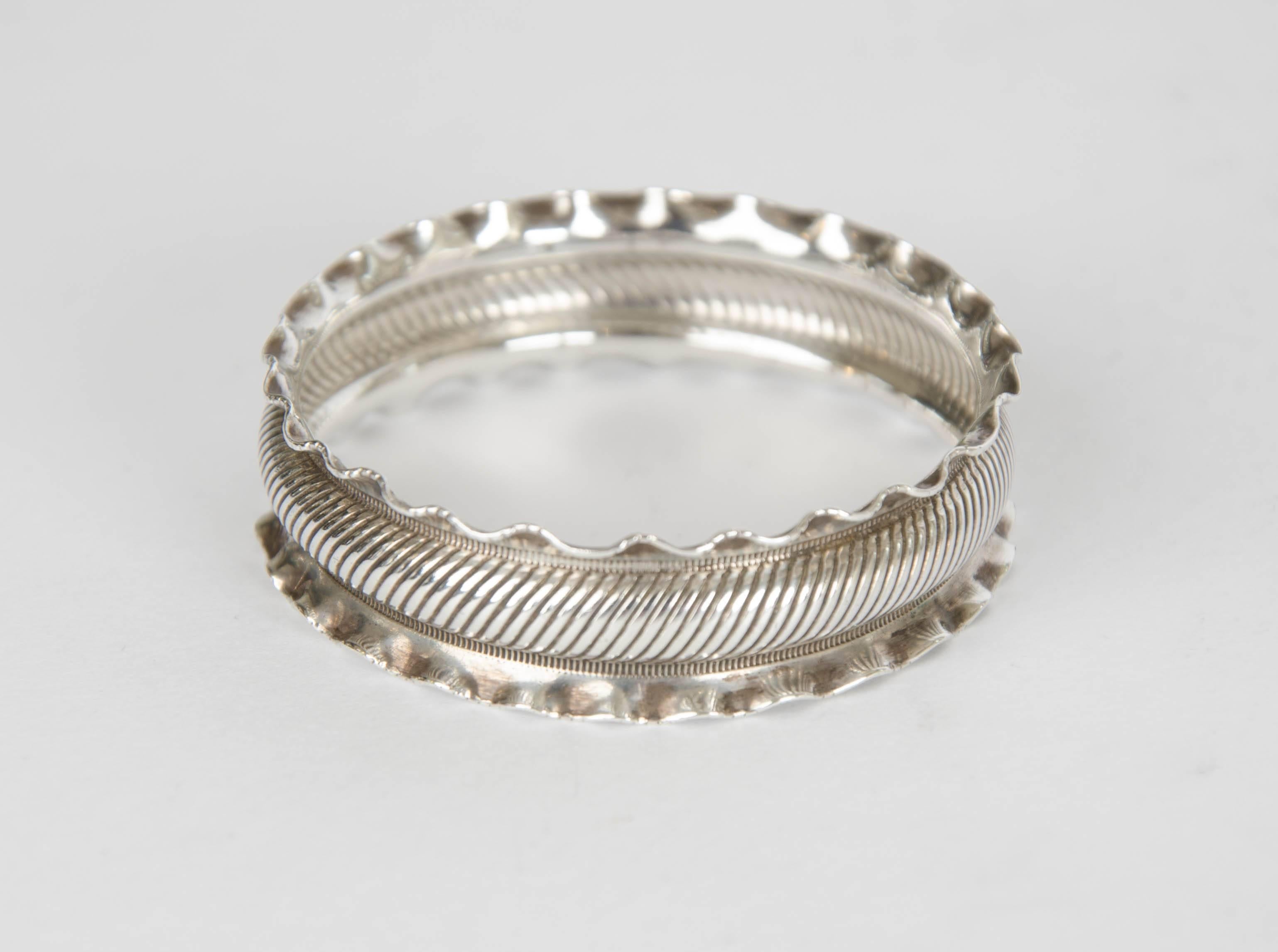 Pair of sterling silver napkin rings with original box, circa 1891, Birmingham. 
The weight for the pair is 0.5 ounces. The box is dark brown leather, gold clasp and lined with a pale blue satin. The rings are cased in a dark blue velvet.