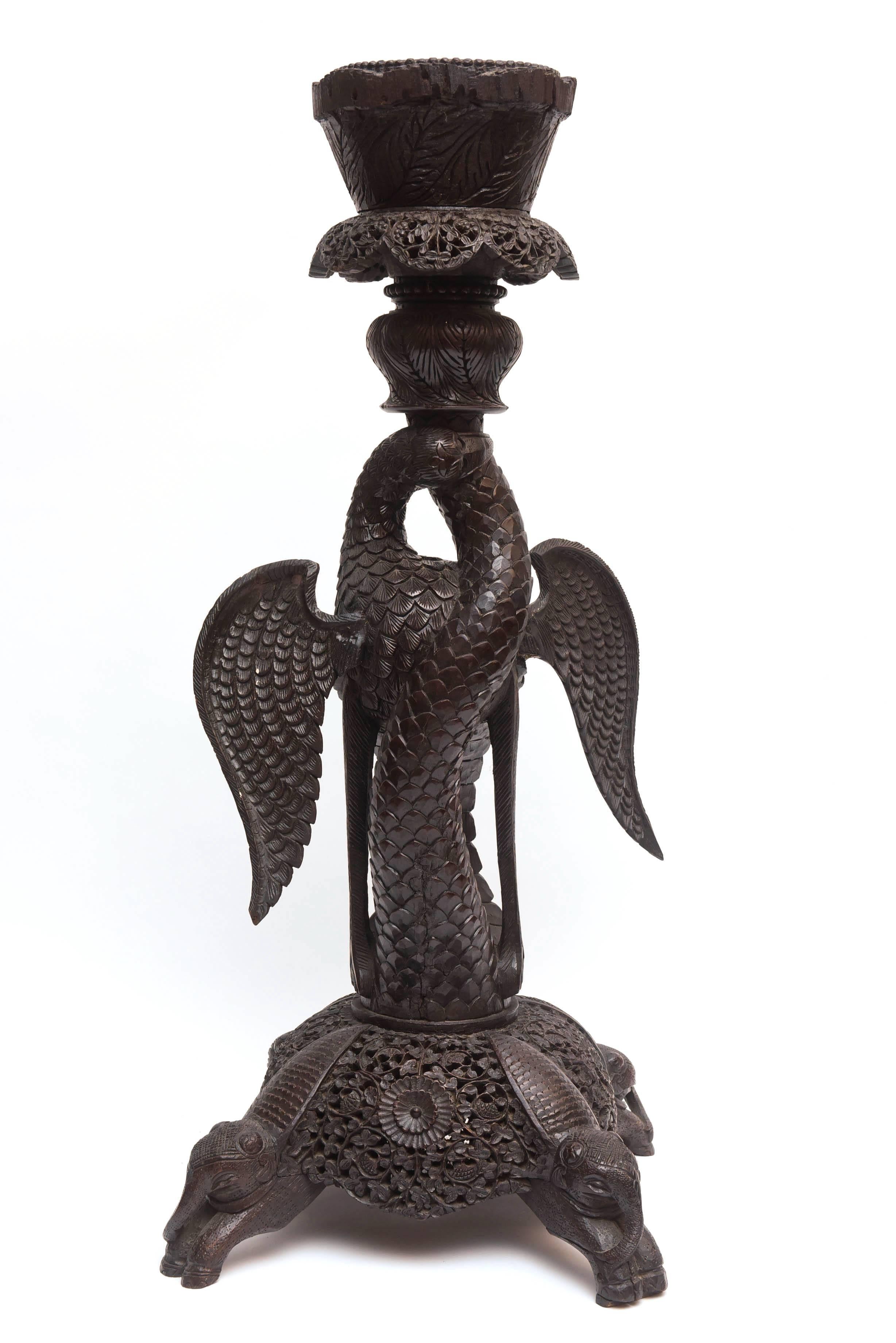 Most unusual "bird" form with intricate carving. Dramatic in size and style, the figure of the bird with outstretched wings is rare. As an enhancement, the piece is raised upon elephant form feet. An outstanding and rare "palace"