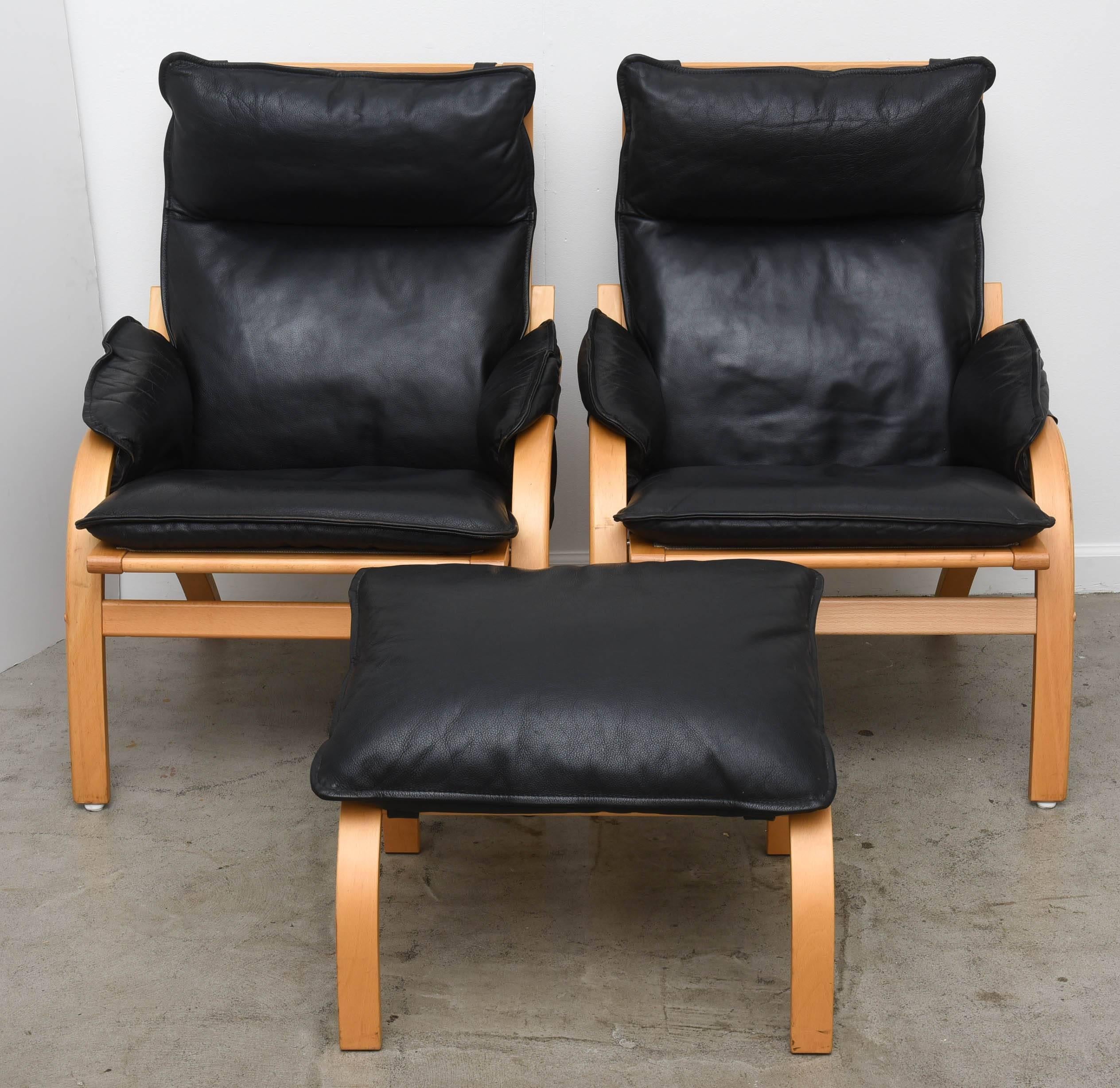 Pair of Mogens Hansen designed Beechwood Framed Lounge Chairs and ottoman with original black leather. Circa 1980's.'
