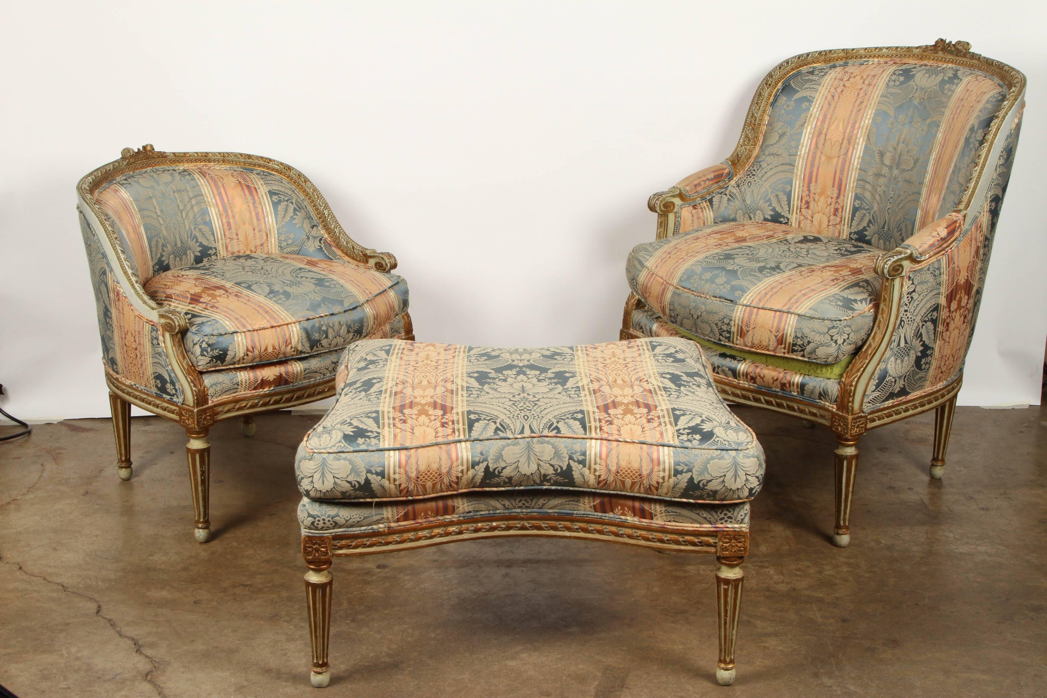 In three parts, Neo Classical Style Patined and Parcel Gilt Diushesse Brisee. In three parts; each piece with painted, carved and gilt wood, acanthus leaves to the short armrests and stiles, patera to the orners, raised on fluted triangular tapered