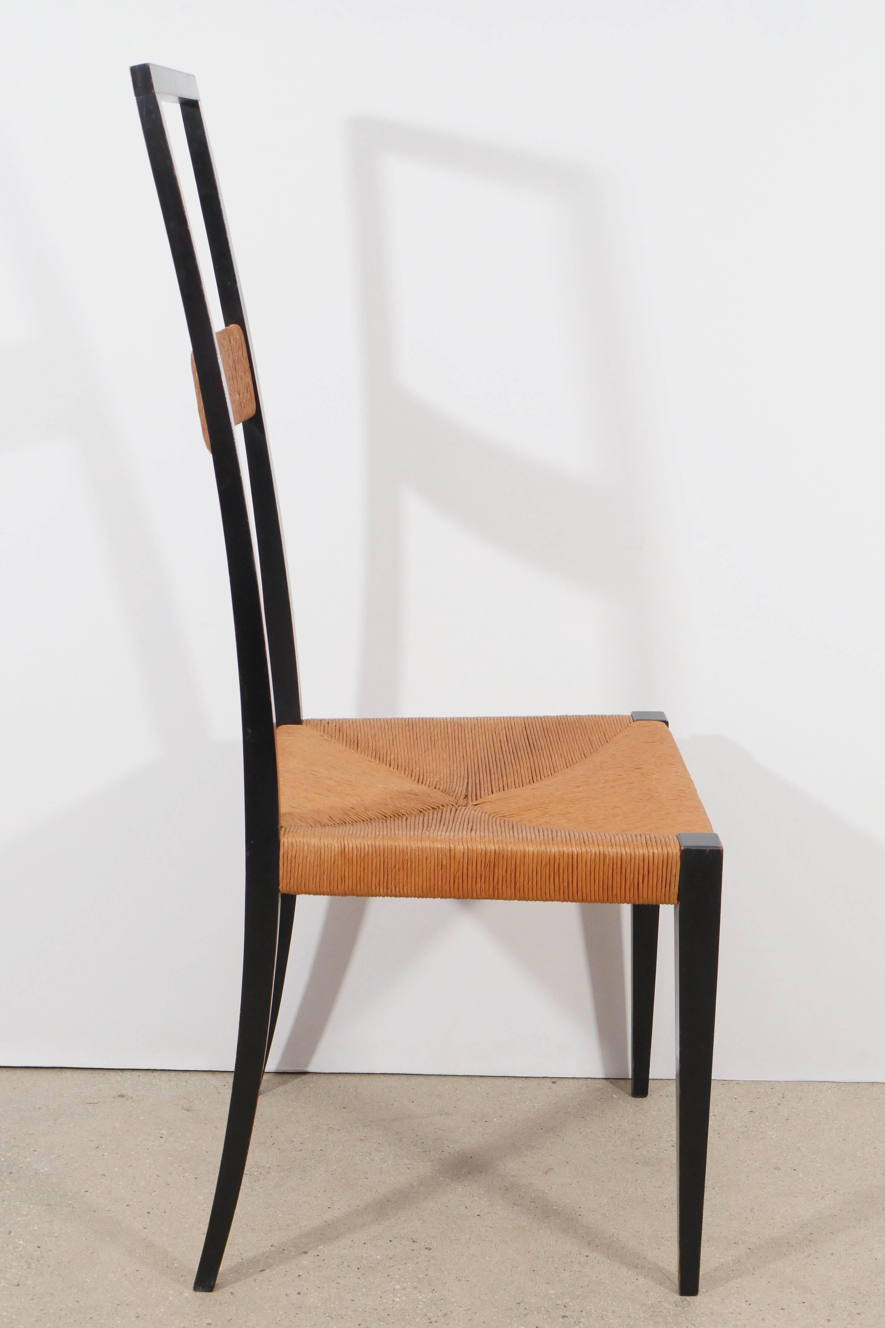 Bold geometric interpretation of a Classic Italian chair design, elegantly attenuated, yet both sturdy and comfortable, Italian, 1950s.