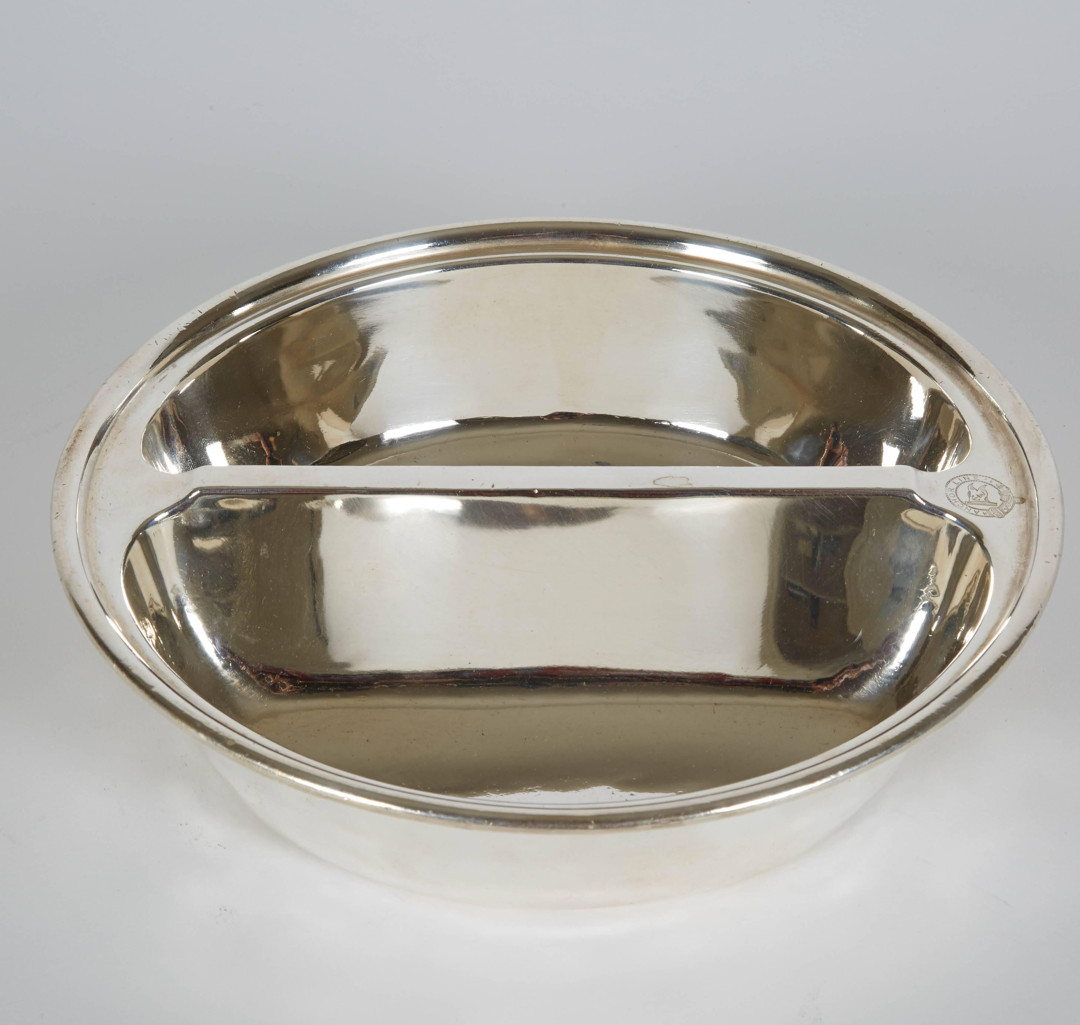 Vintage hotel silver round divided dish from England. It sports the badge of 