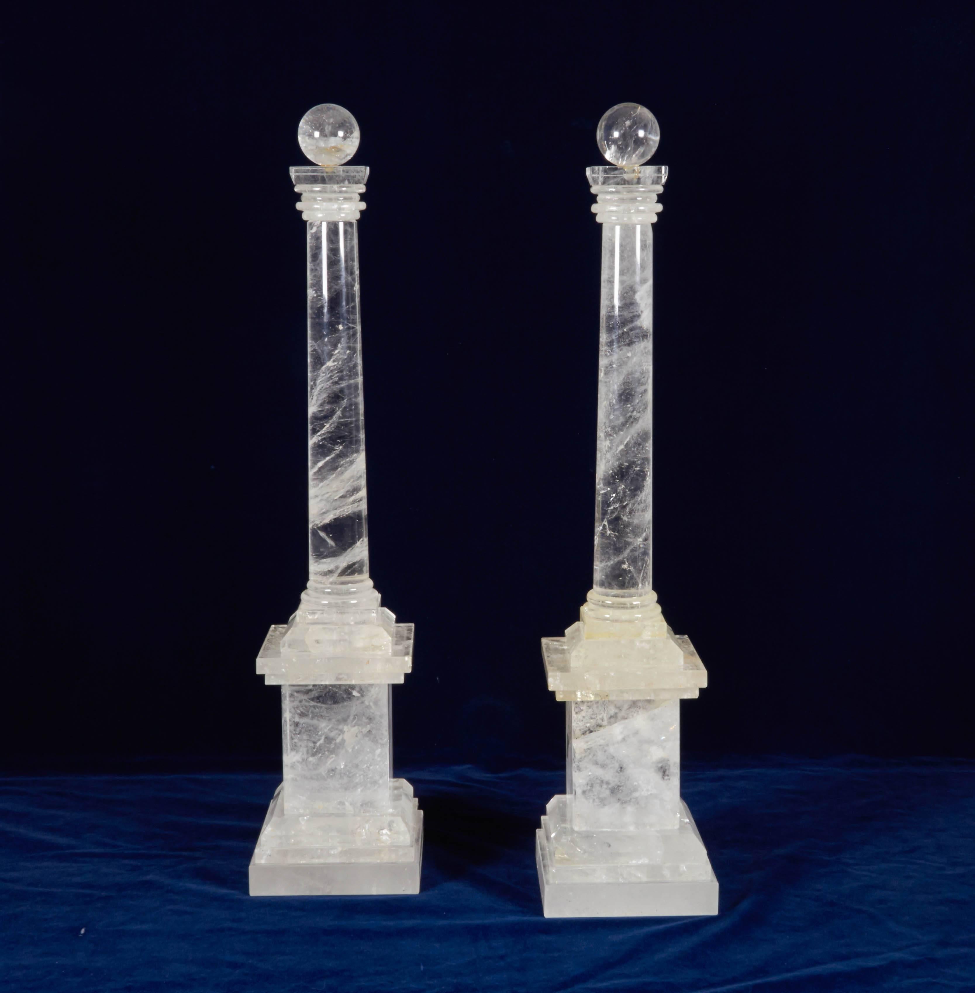 A monumental pair of French Art Deco style hand-carved rock crystal quartz obelisks after the Grand Tour model, 