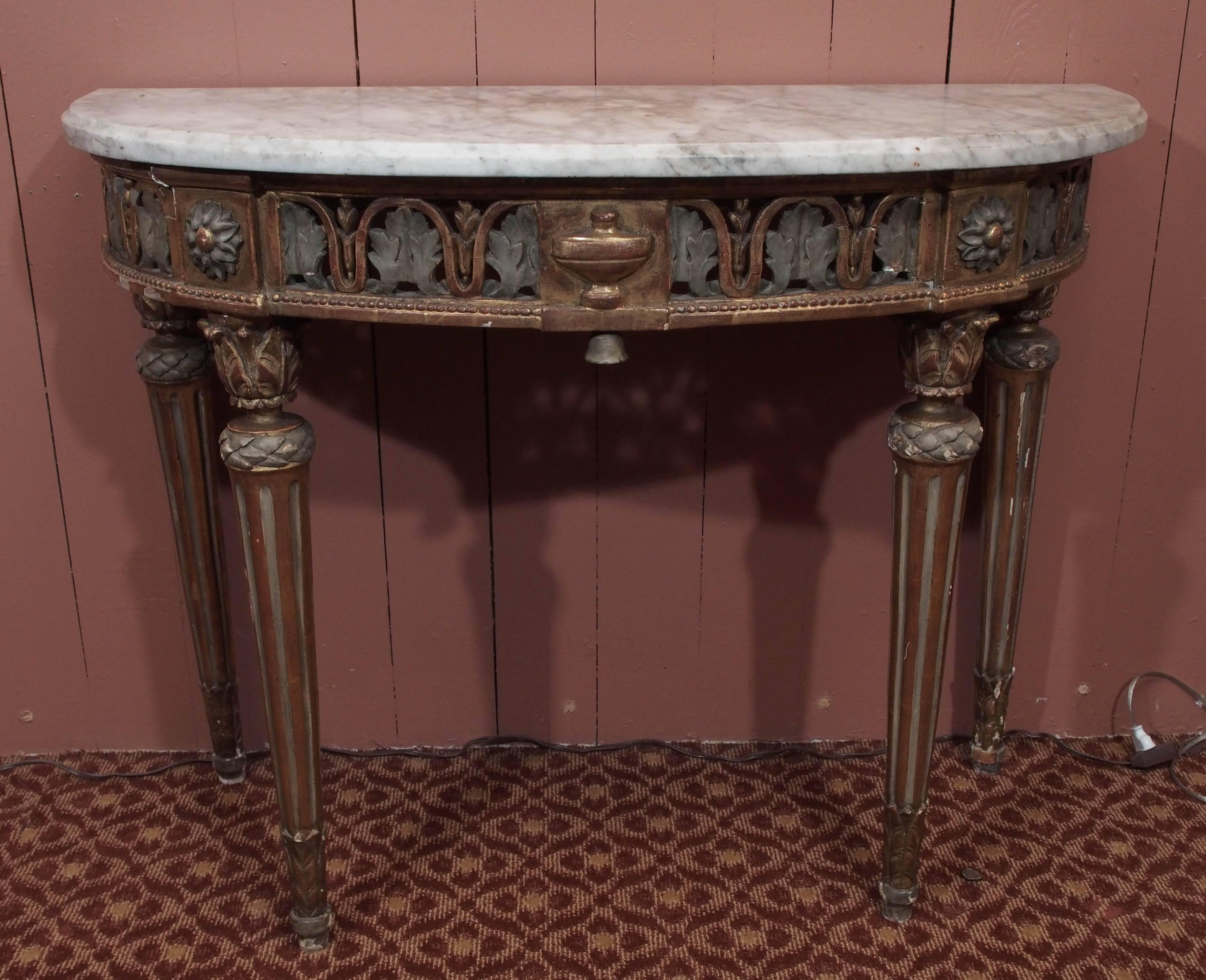 French Louis XVI period painted and gilded demi-lune console with carved decoration in the neoclassical taste and white marble top