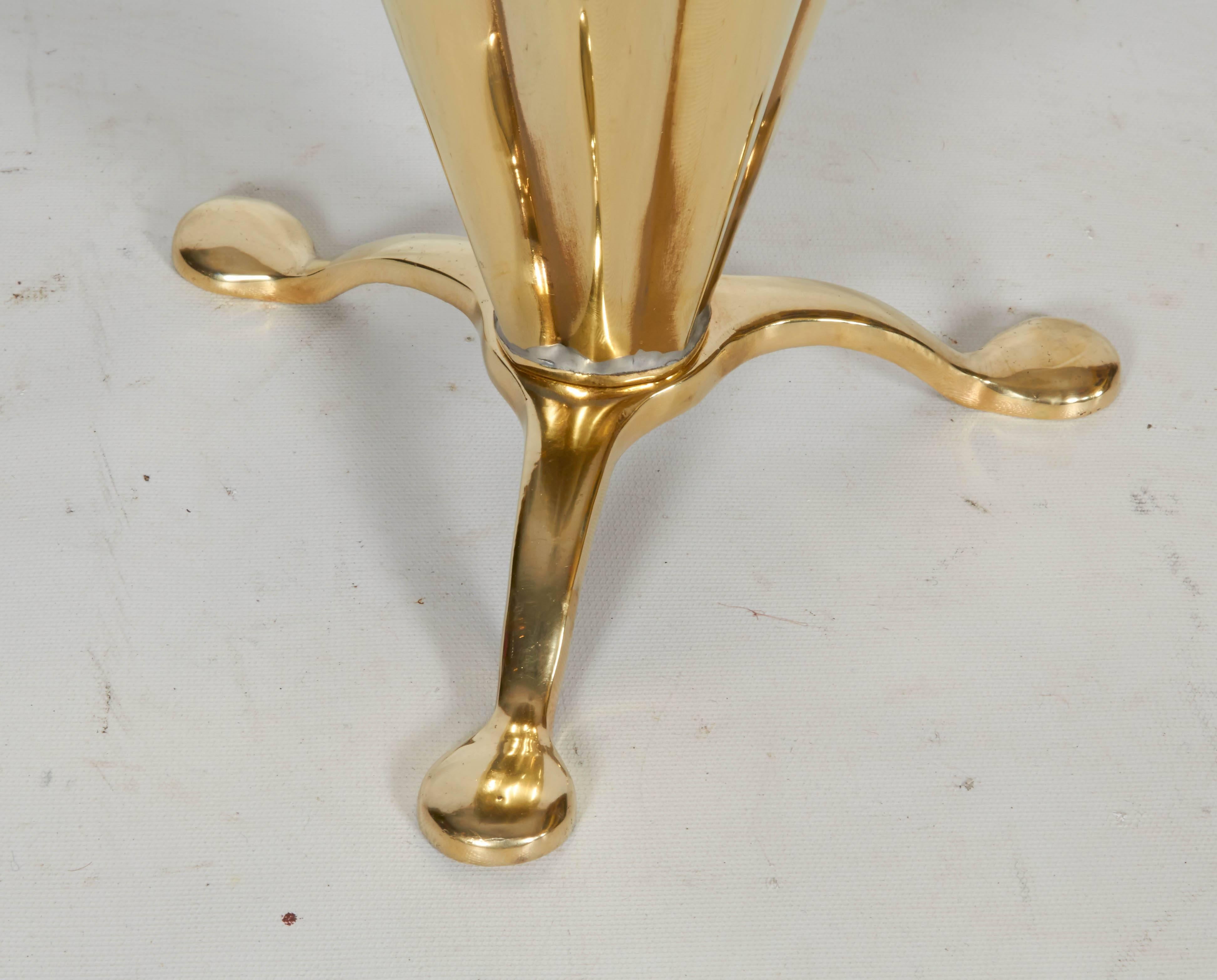 Charming, figural, footed brass umbrella stand with pleats, trim, and handle. Please contact for location.