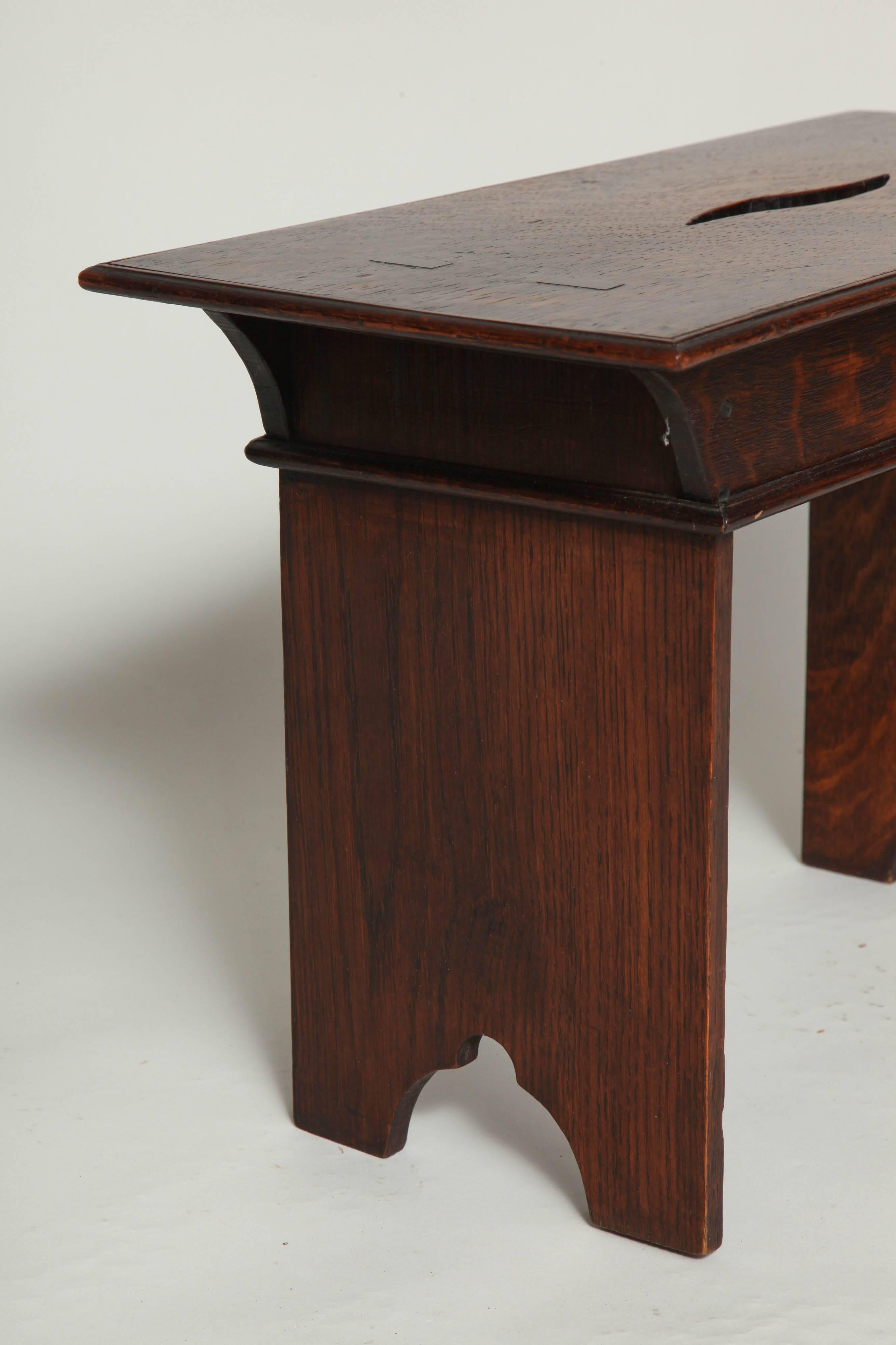 Fine English Arts and Crafts period oak stool, the molded top with through tenon construction, over shaped 