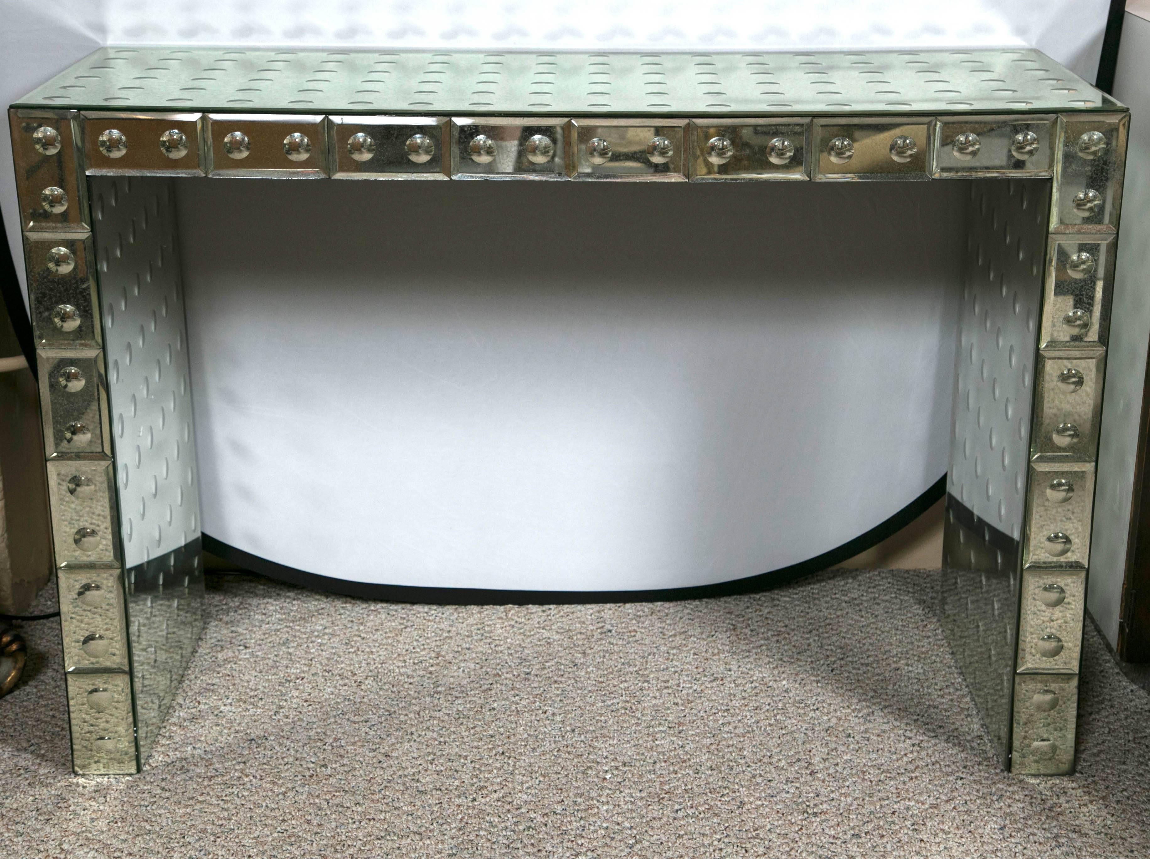  Bullseye decorated block front console. Fabulously Vintage Hollywood Regency design and style. A solid frame with great spacious tops. This console will make a wonderfully glamorous statement in any section of the home.