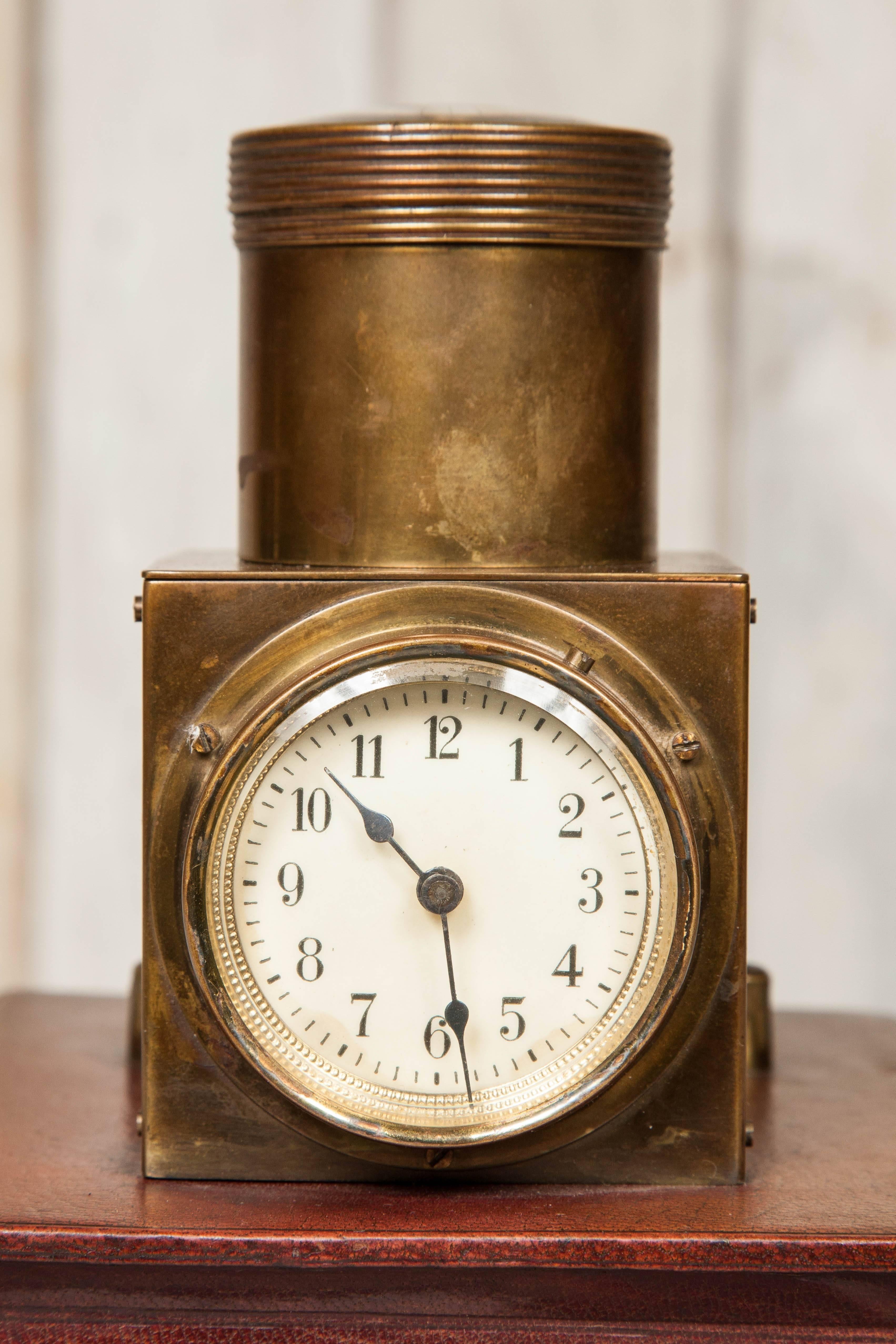 An original antique projector clock by Junghans, made circa 1890. This ingenious and rare item used a lightbulb and mirror to project the clock face onto the ceiling. The box has a thin leather casing whilst the clock mechanism is within a brass