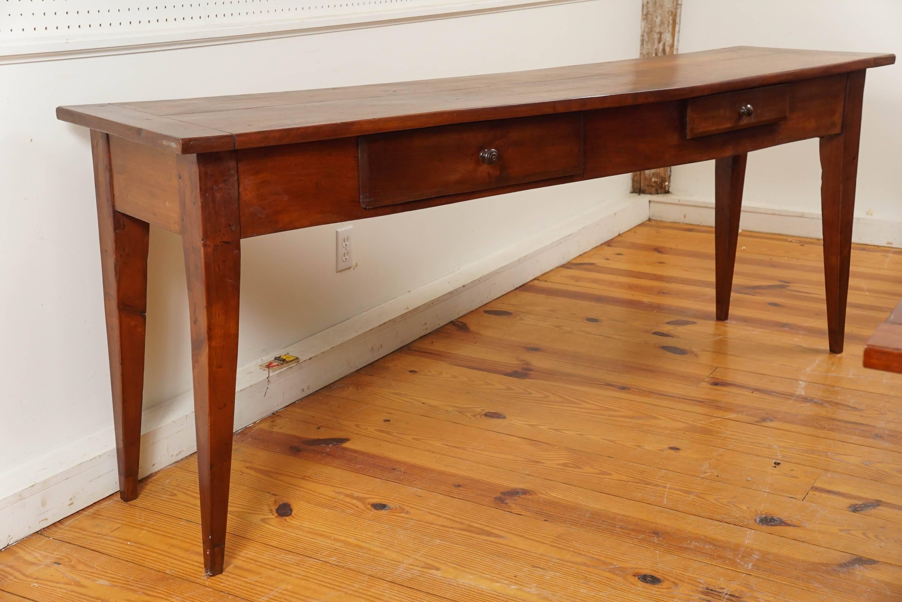 This French serving table has two drawers, each a different size. That was quite common for the French and adds great character to this piece. What dominates your eye on this server is the patina. It is gorgeous! In a hallway or under a long sofa