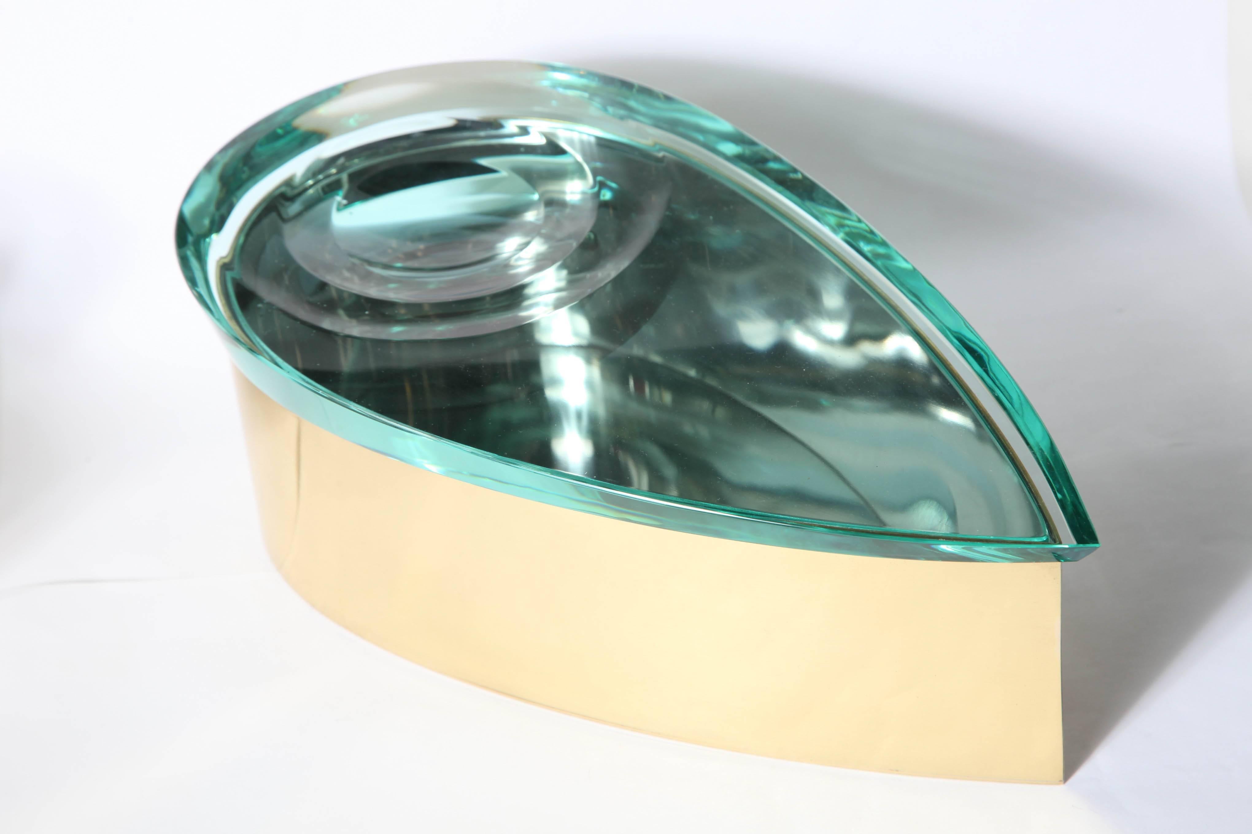 Stunning sculpture cut and polished glass box made in Milan designed by Roberto. G. Rida, titled (drop). Three carved concentric circles on a thick glass cover, fitting on to a burnished brass base signed, great quality.