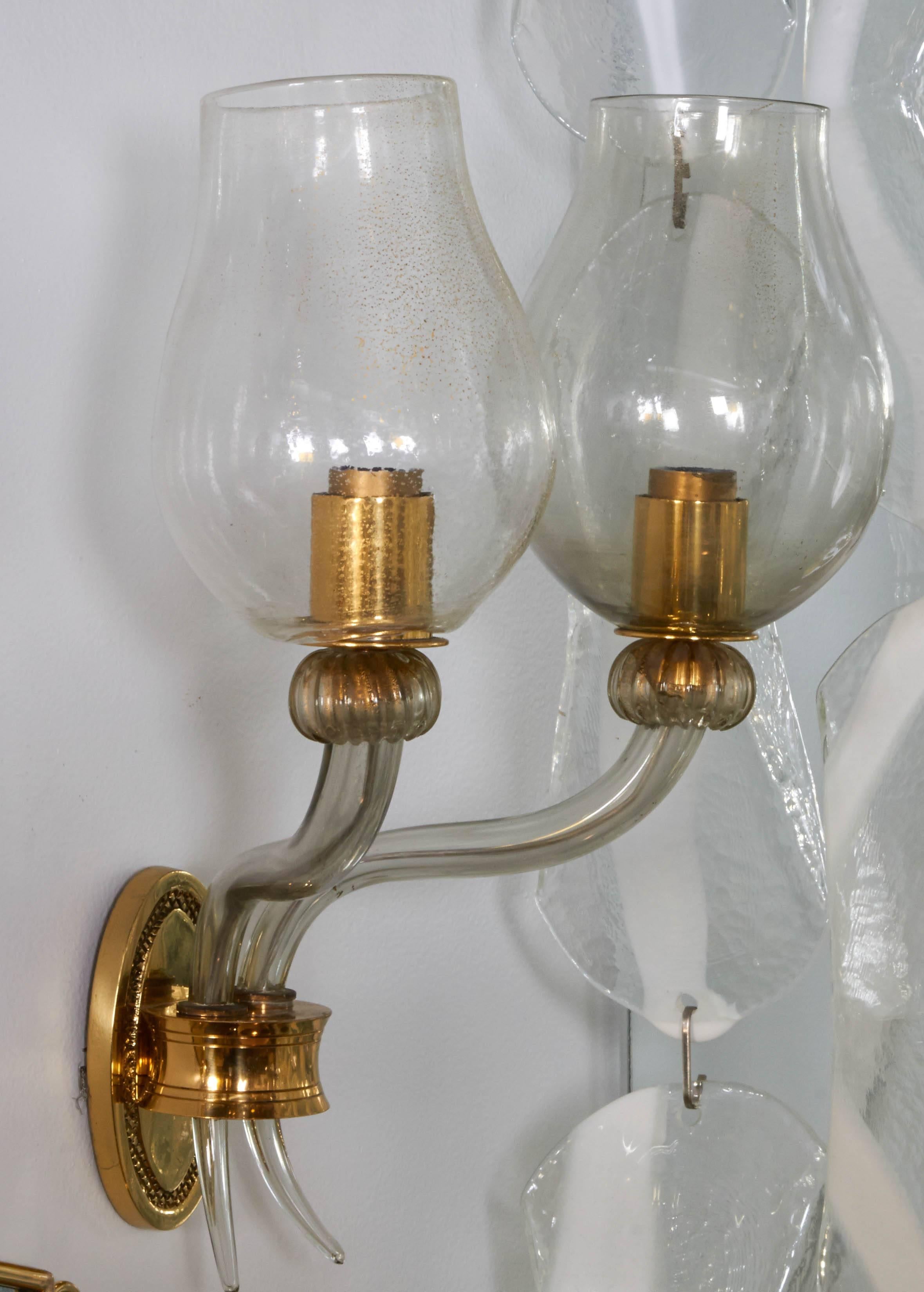 A single lovely Venetian hand blown glass two-light sconce, circa 1930-1940. Cast brass mount and socket covers. Hand blown grey with gold flecks aventurine glass. One shade paler in color than the other. Each shade is slightly different at they are