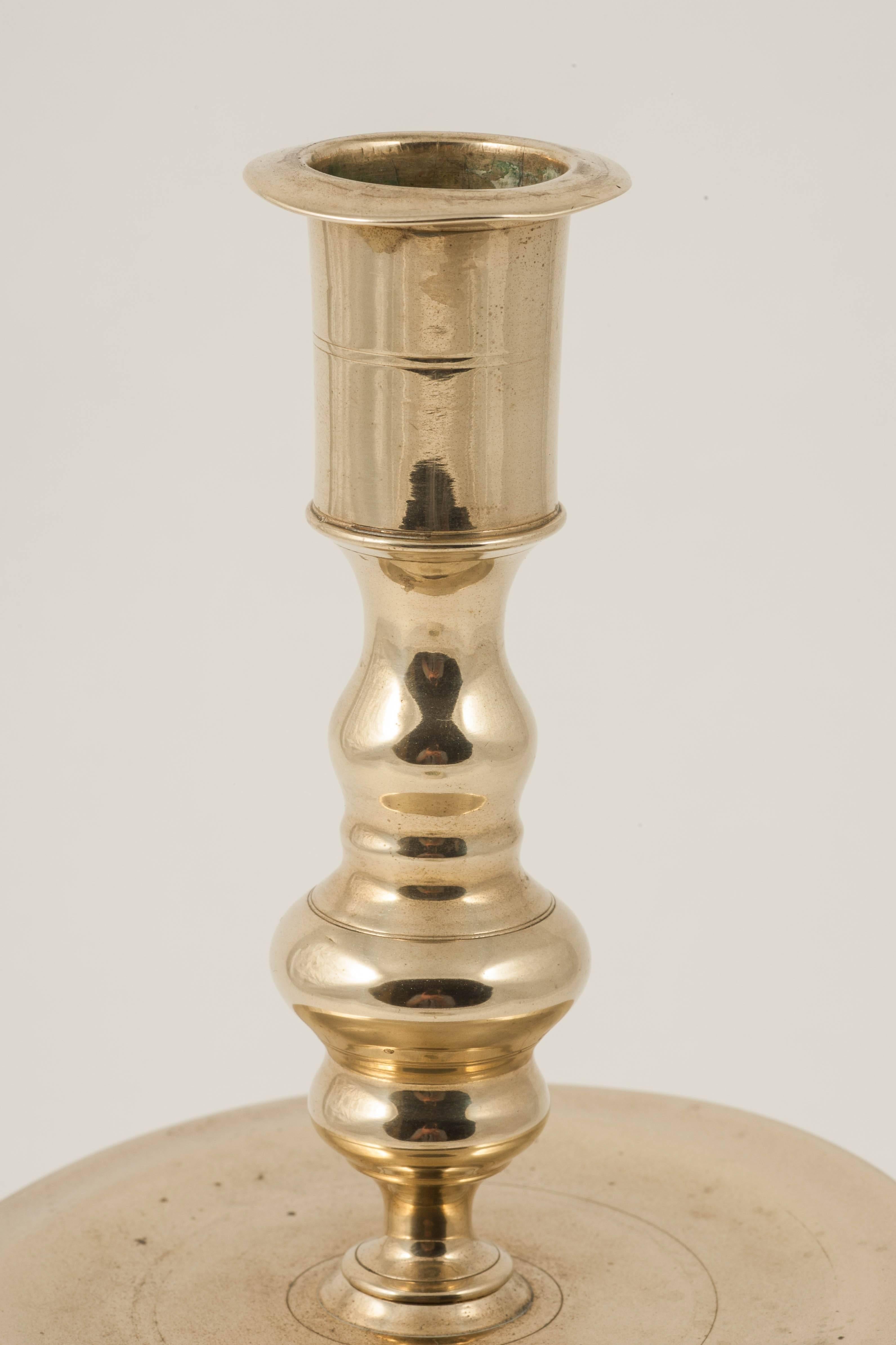This candlestick is constructed of two parts - the baluster-formed top, having a fine hand-cut thread - and the bell-formed base with drip-pan. 

The guilds in Nuremberg ensured that each master kept standards to an exceptional level. Objects