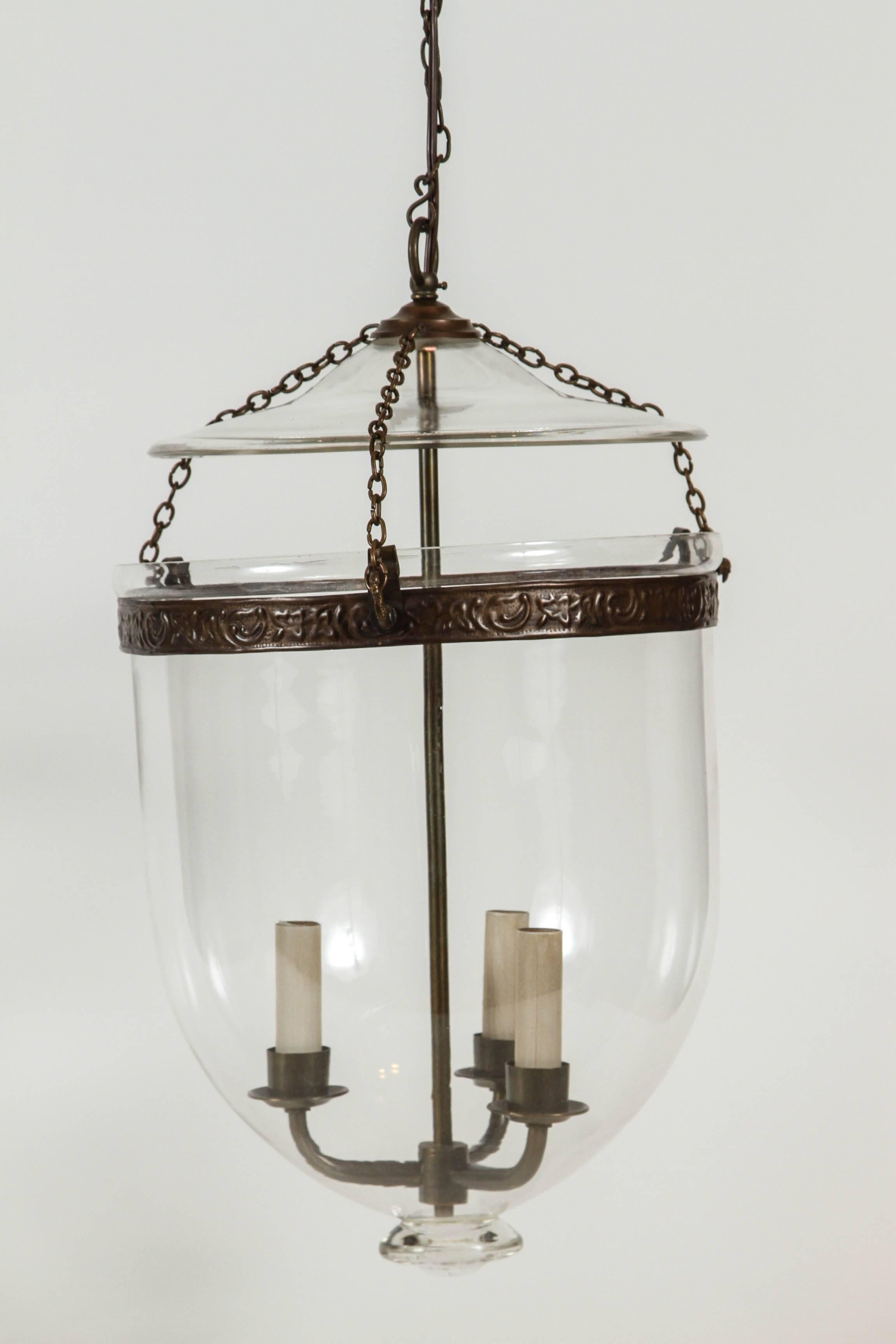 Pair of vintage glass pendant lanterns featuring a chain suspended lid with bird hook detail. Newly wired for USA use. Takes three candelabra bulbs. 

Dimensions: 12 1/8