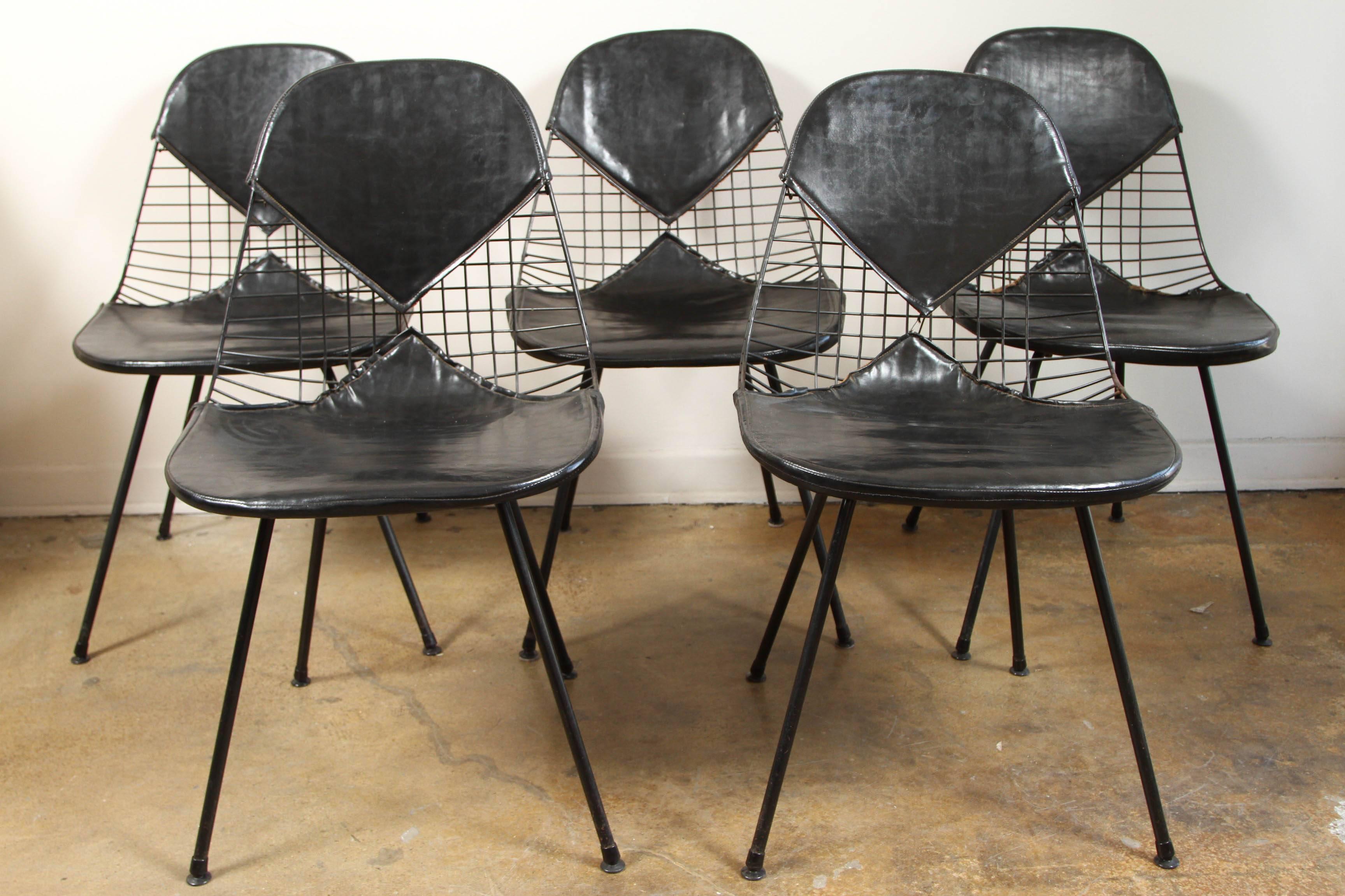 A set of four early Eames bikini chairs.