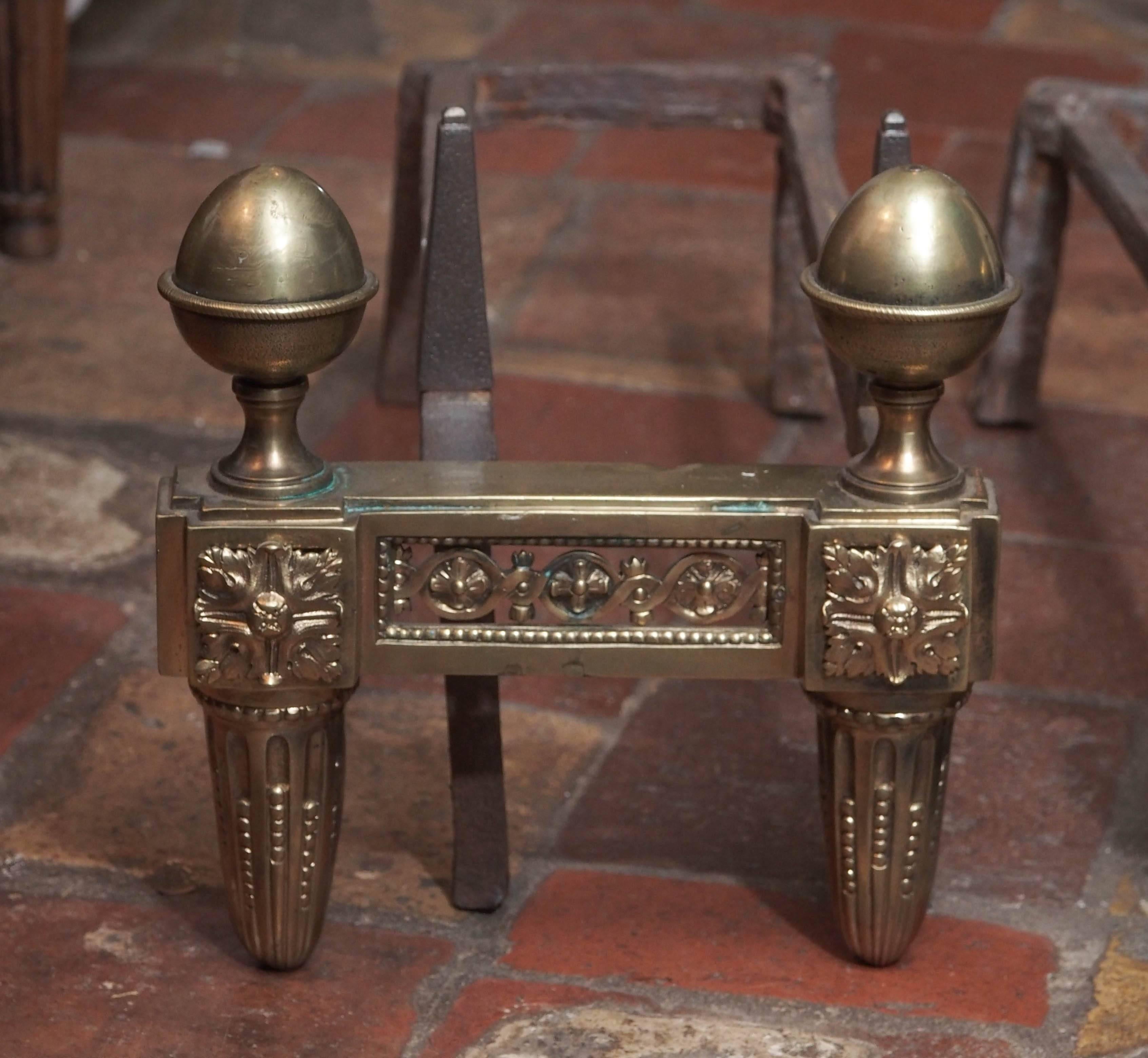 Rare pair of 18th century hand-forged French Louis XVI style bronze andirons, circa 1790.