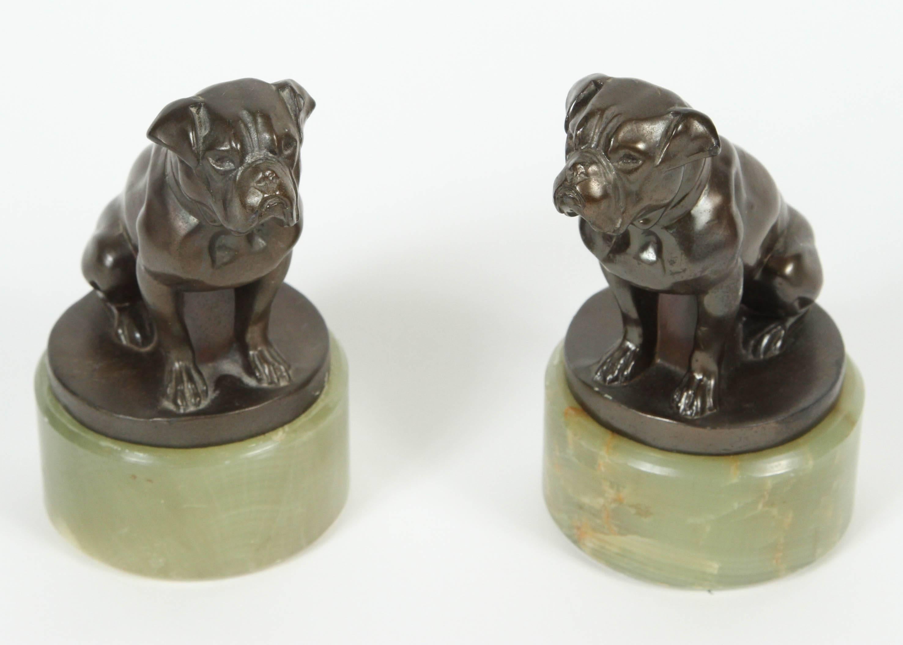 Vintage bookends of bronze English bulldogs on marble base.