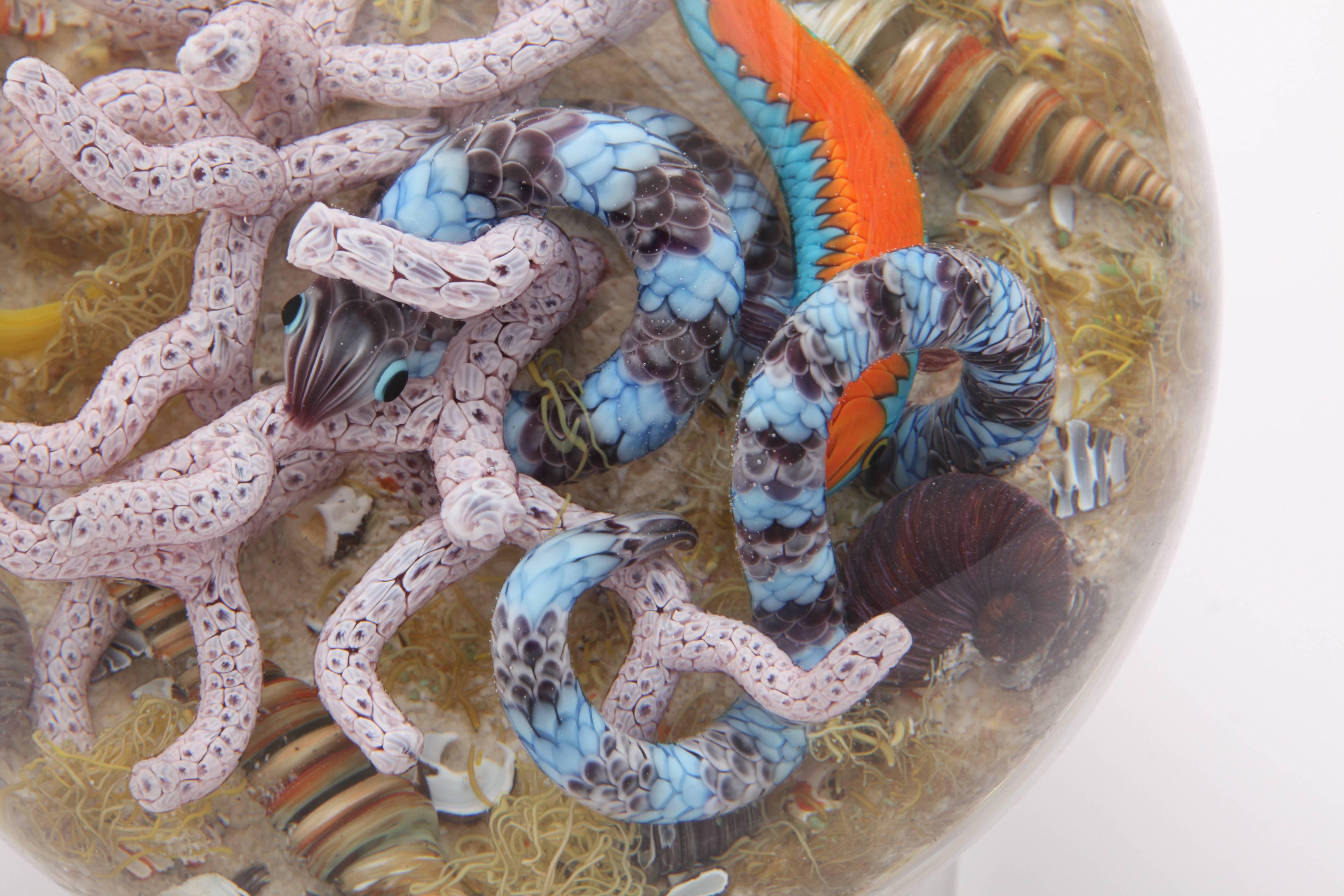A beautiful Gordon Smith sea life paperweight with a Sea Krait snake, Yellow wrasse fish, Pseudo Chromis fish , sea shell and coral all on a sandy ground, signed GS 2015, 19