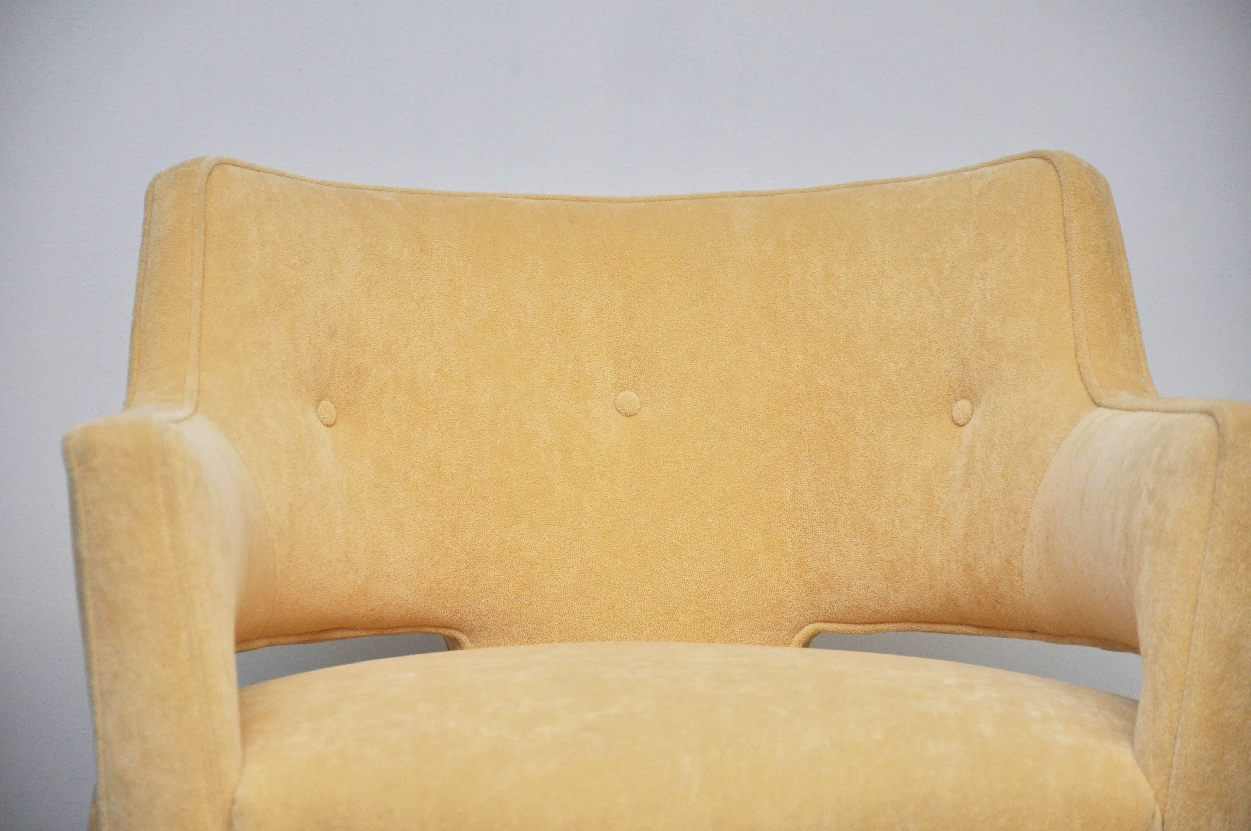 Open-arm swivel lounge chairs. Designed by Edward Wormley.