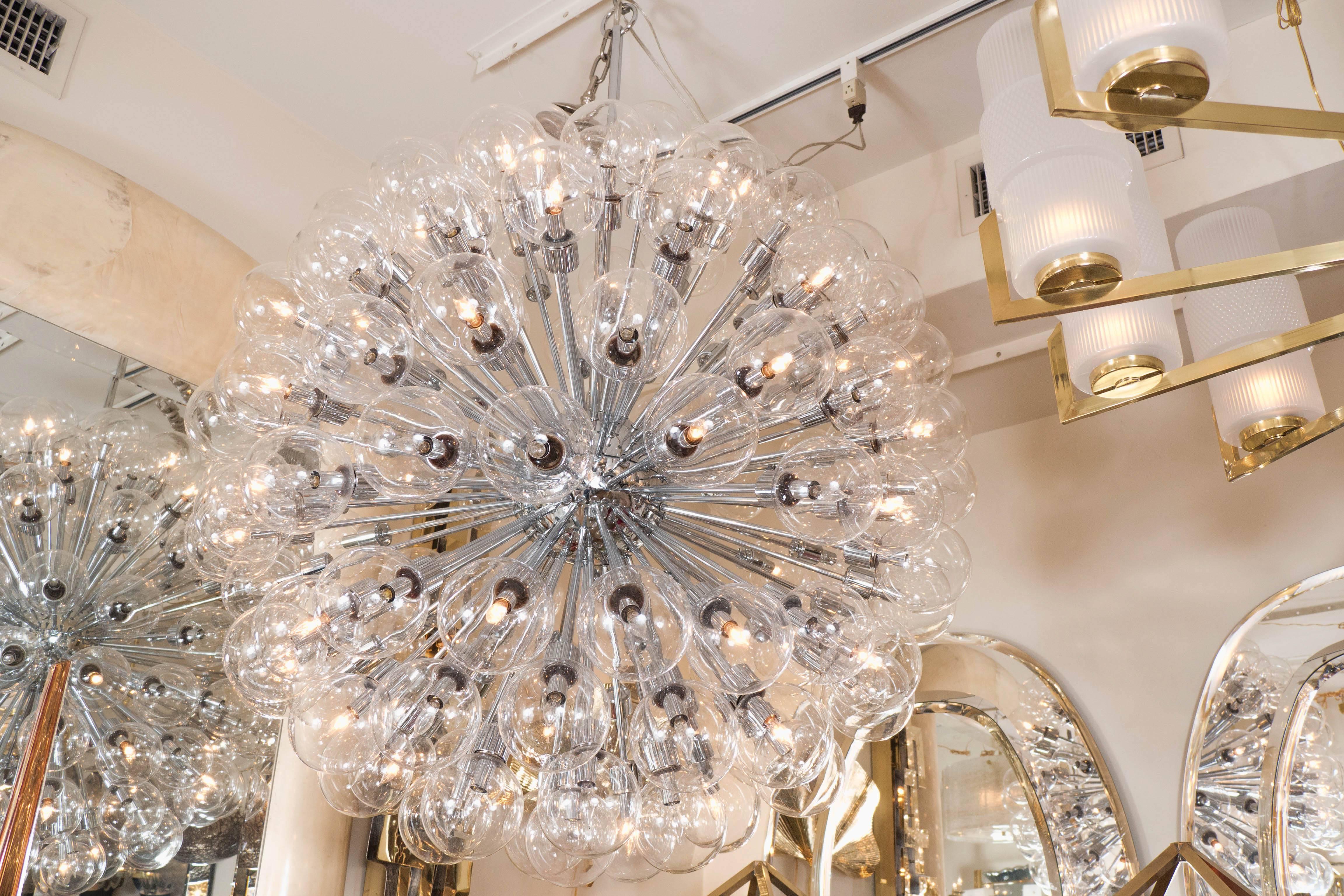 Monumental polished chrome Sputnik chandelier featuring spherical clear glass shades by Motoko Ishii for Staff Leuchten.
   