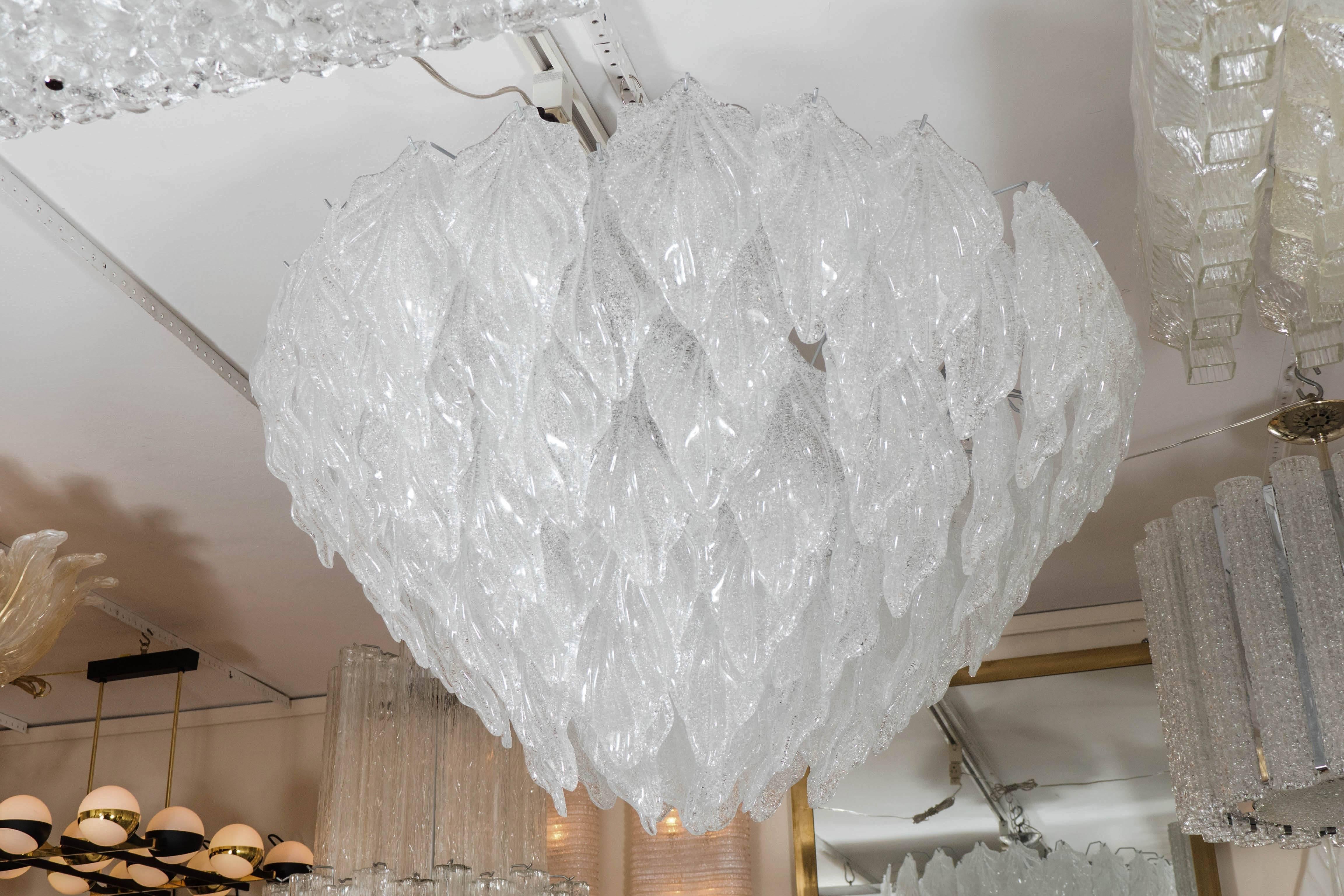 Multiered chandelier composed of textured Murano glass foliate form elements.