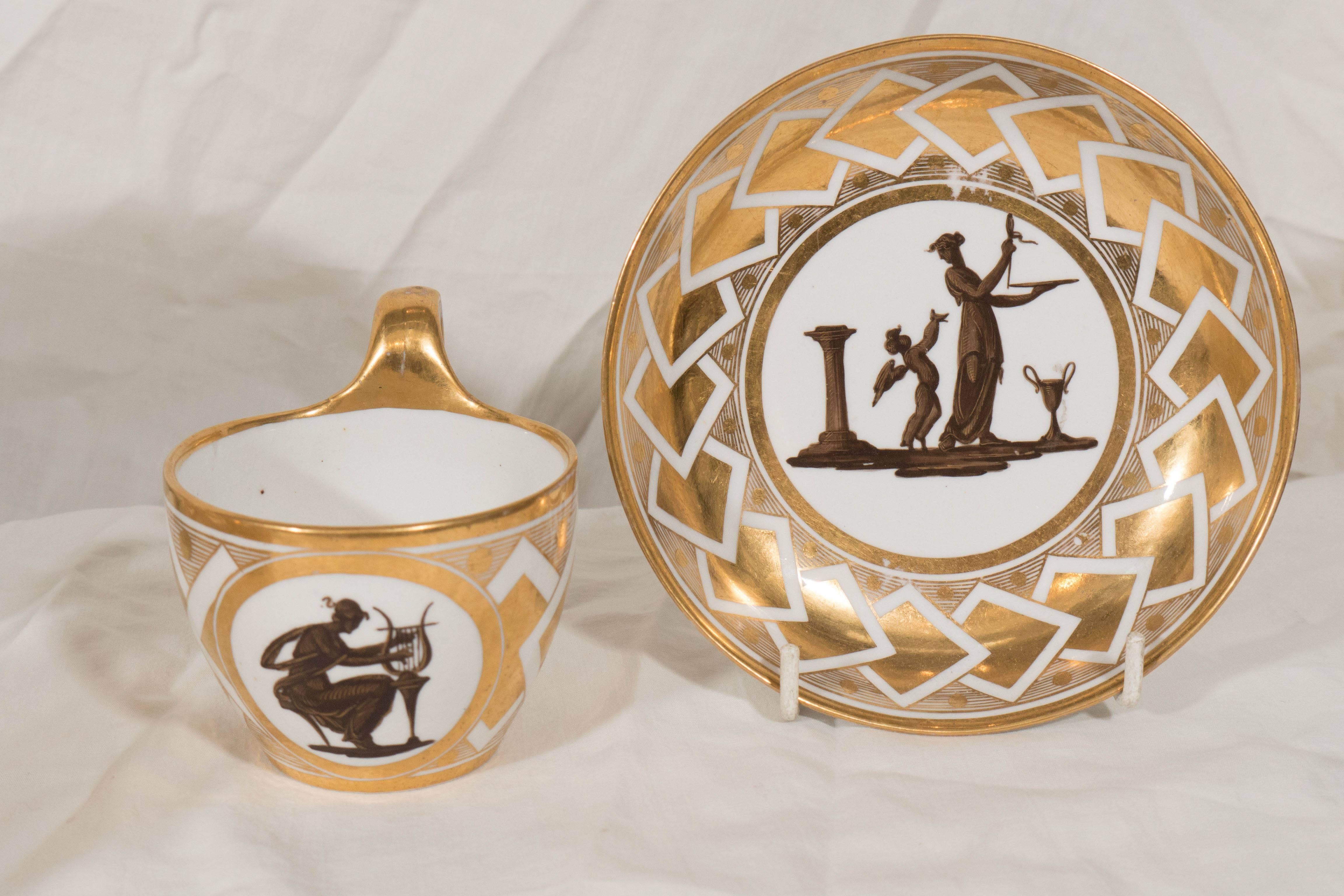 A group of four Coalport neoclassical cups and saucers each hand-painted with a monochrome silhouette of a classical figure acting out a dramatic scene. Each border is decorated in gilt with crisp neoclassical designs.

 