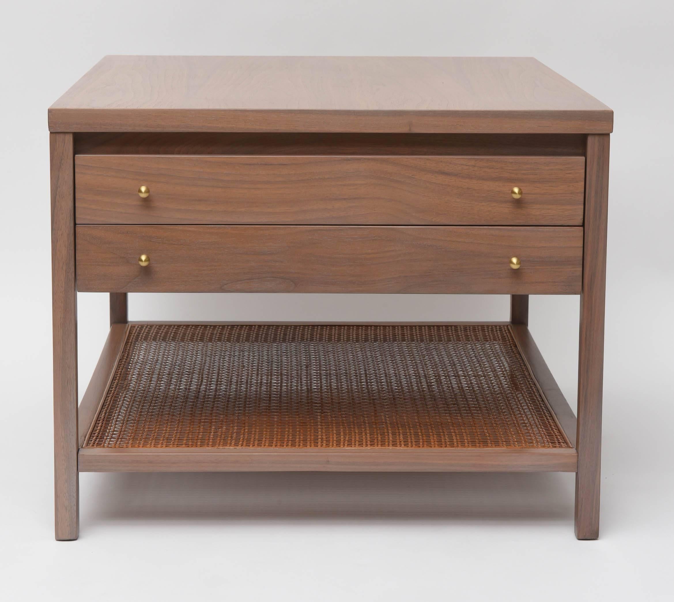 Large 1950s grey washed walnut side table by Paul McCobb for Calvin with woven rattan bottom shelf in its original natural rattan and brushed brass knobs.