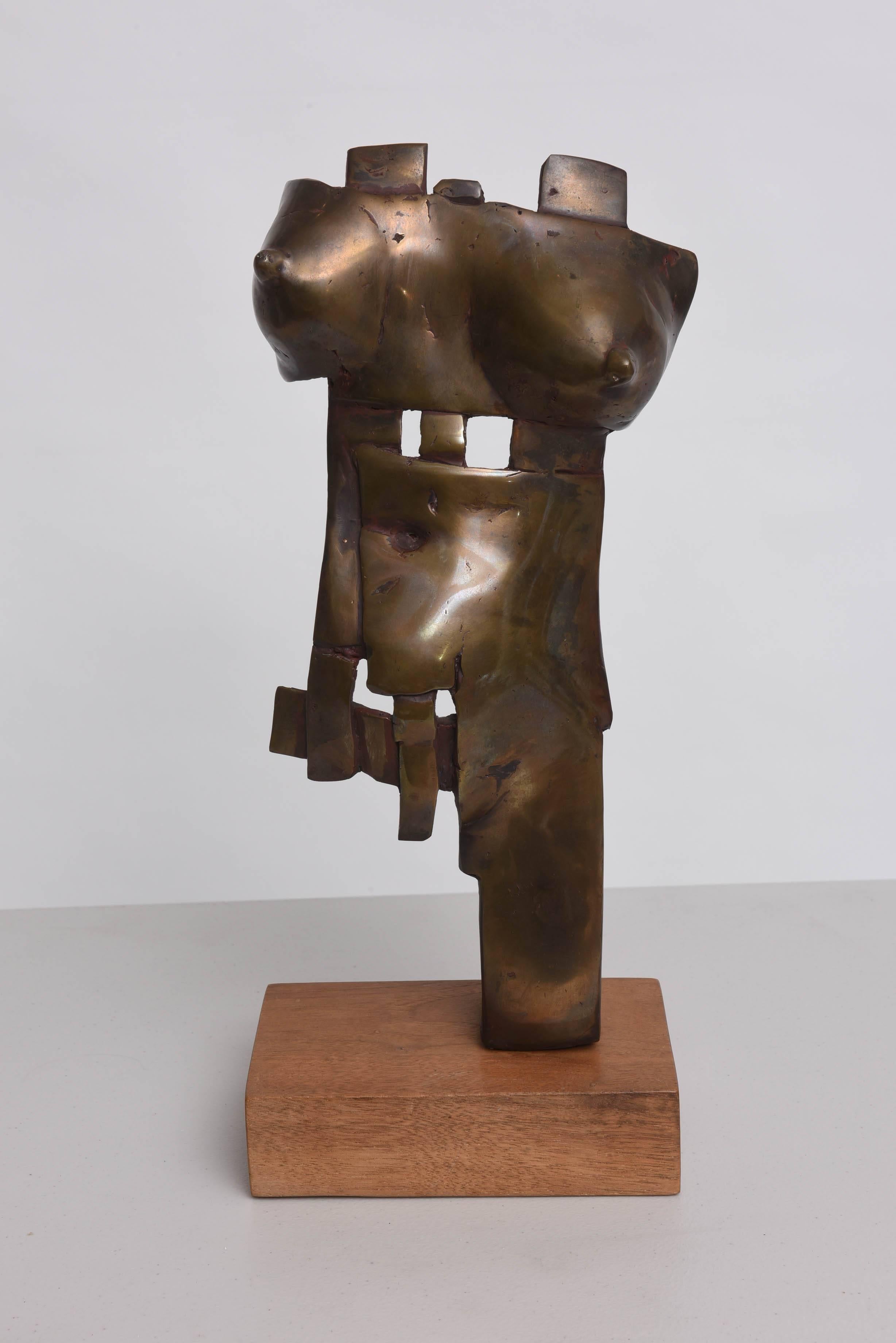 This amazing sculpture was created in the 1960s and is signed.  Unfortunately the signature is not legible, so will remain a mystery for now.  

Here the sculptor has expressed the female form with a brutalist-hand which shows a force of power and