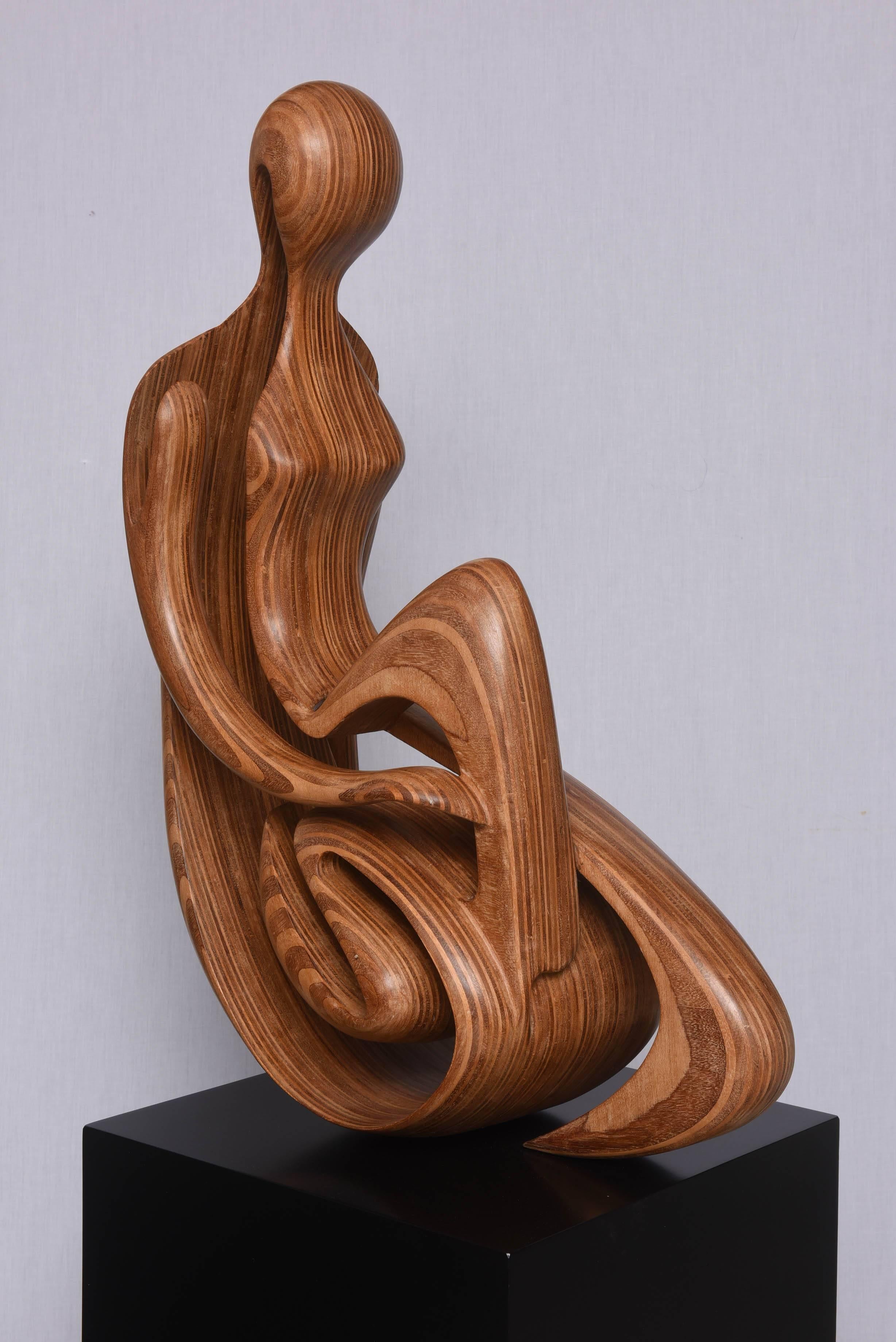 This amazing sculpture depicts a reclining female in Silhouette. The piece is constructed of veneered woods and then carved-out in the female-form. 

Note: Dimensions of sculpture with base 59" x 18" x 24.50".

Note: Dimensions of
