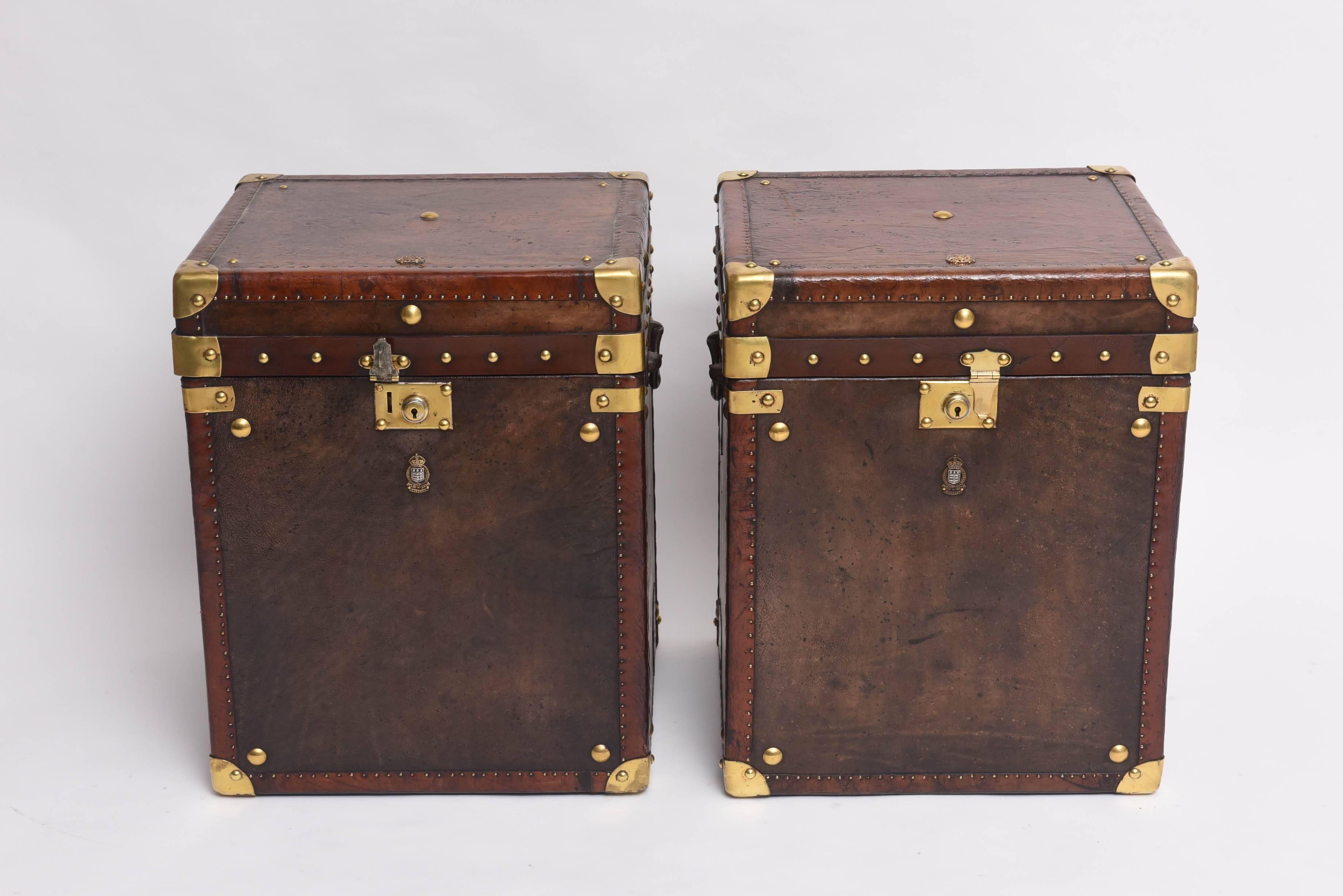 This pair of rare and handsome British-Colonial style leather-clad trunks were purchased in London.  They are referred to as 